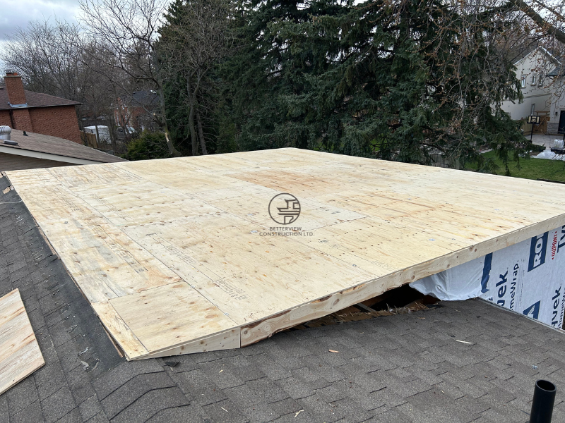 Roof deck sheathing installation for a home addition showing plywood subfloor construction in progress in the GTA