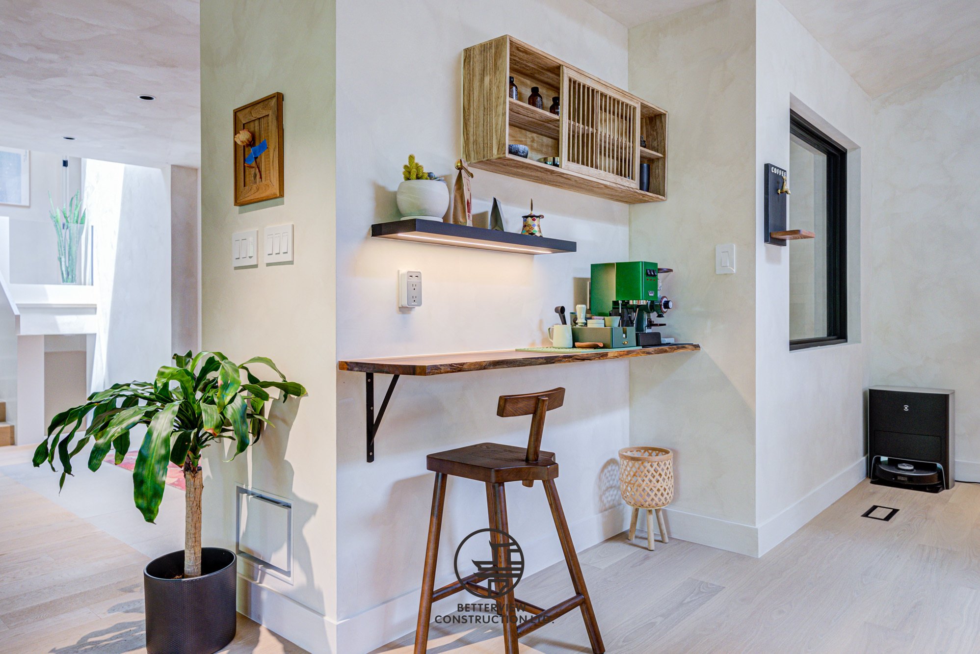 modern home coffee bar with floating shelves and wood counter
