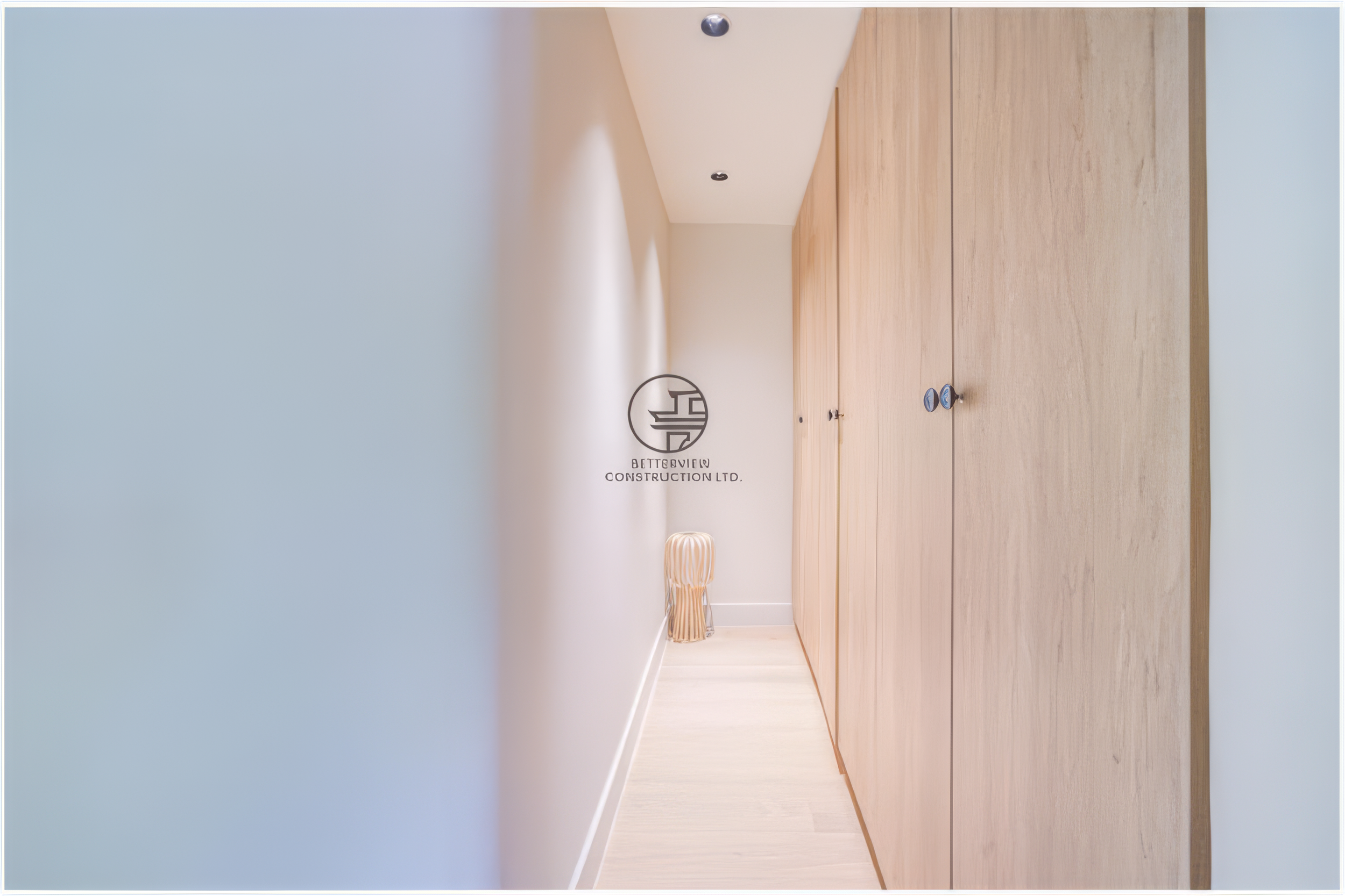 minimalist hallway with built in wood storage cabinets in renovated home