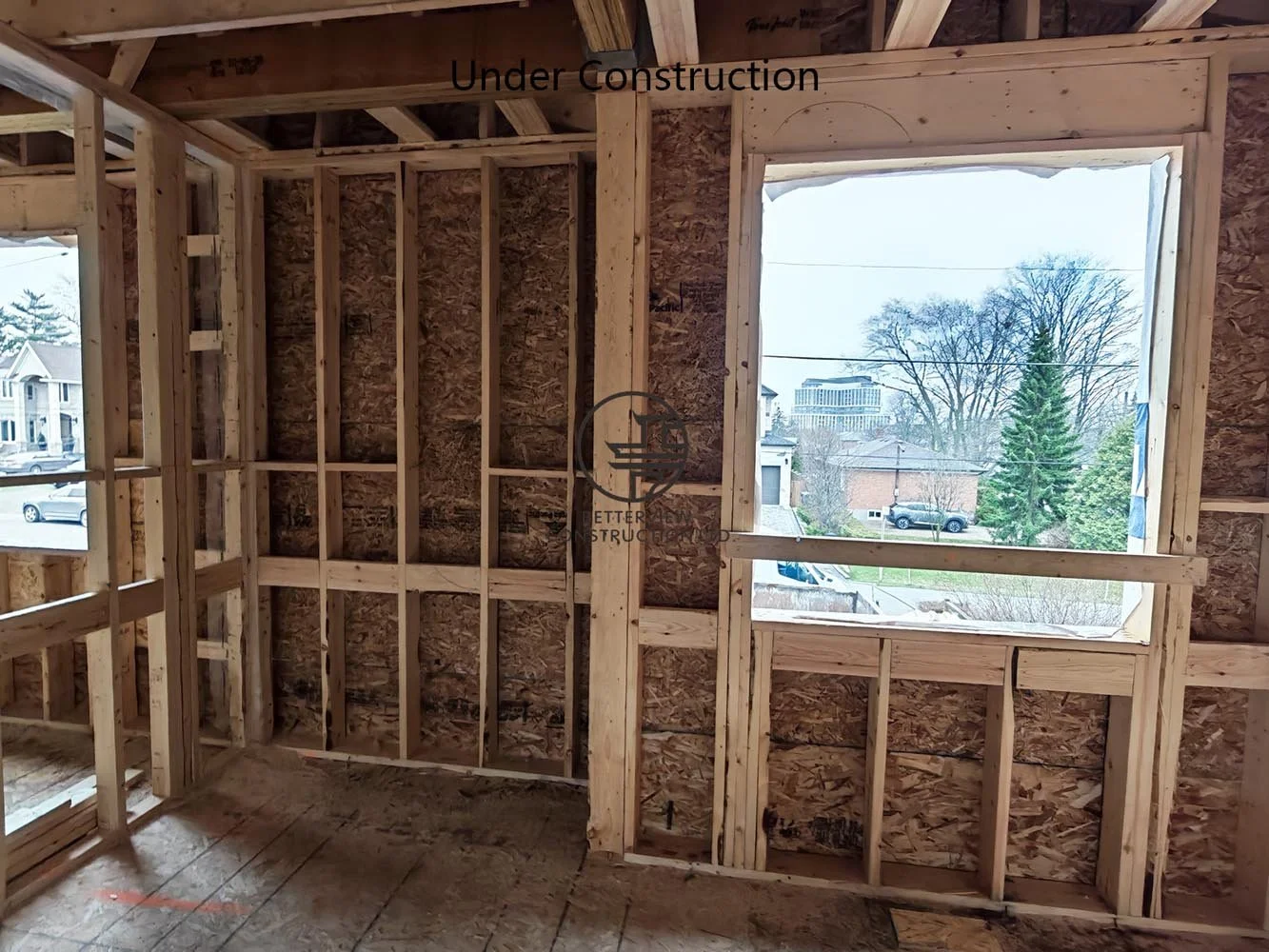 Large window opening framed during residential home addition, designed to increase daylight and improve the modern interior layout.