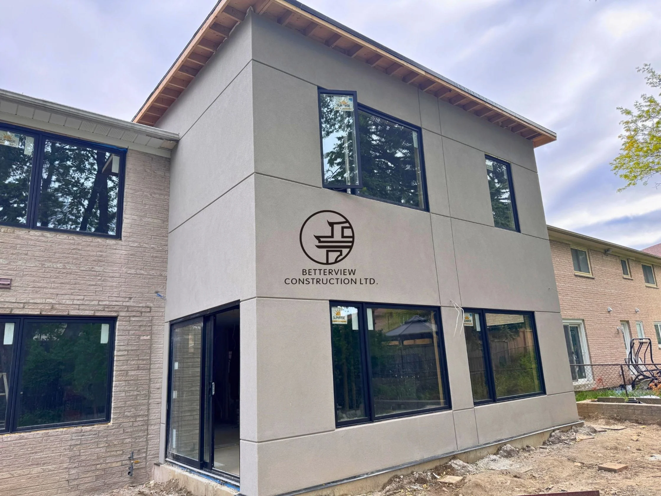 Completed home addition featuring a modern exterior facade, new window installation, and integrated design in a GTA residential property