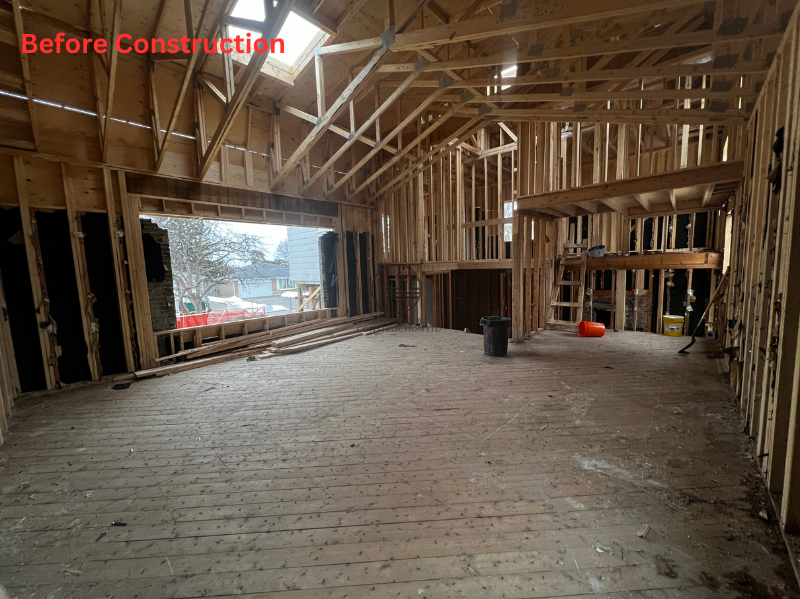 Structural framing stage of a home addition project showing exposed wood framing and open interior layout during construction in the GTA