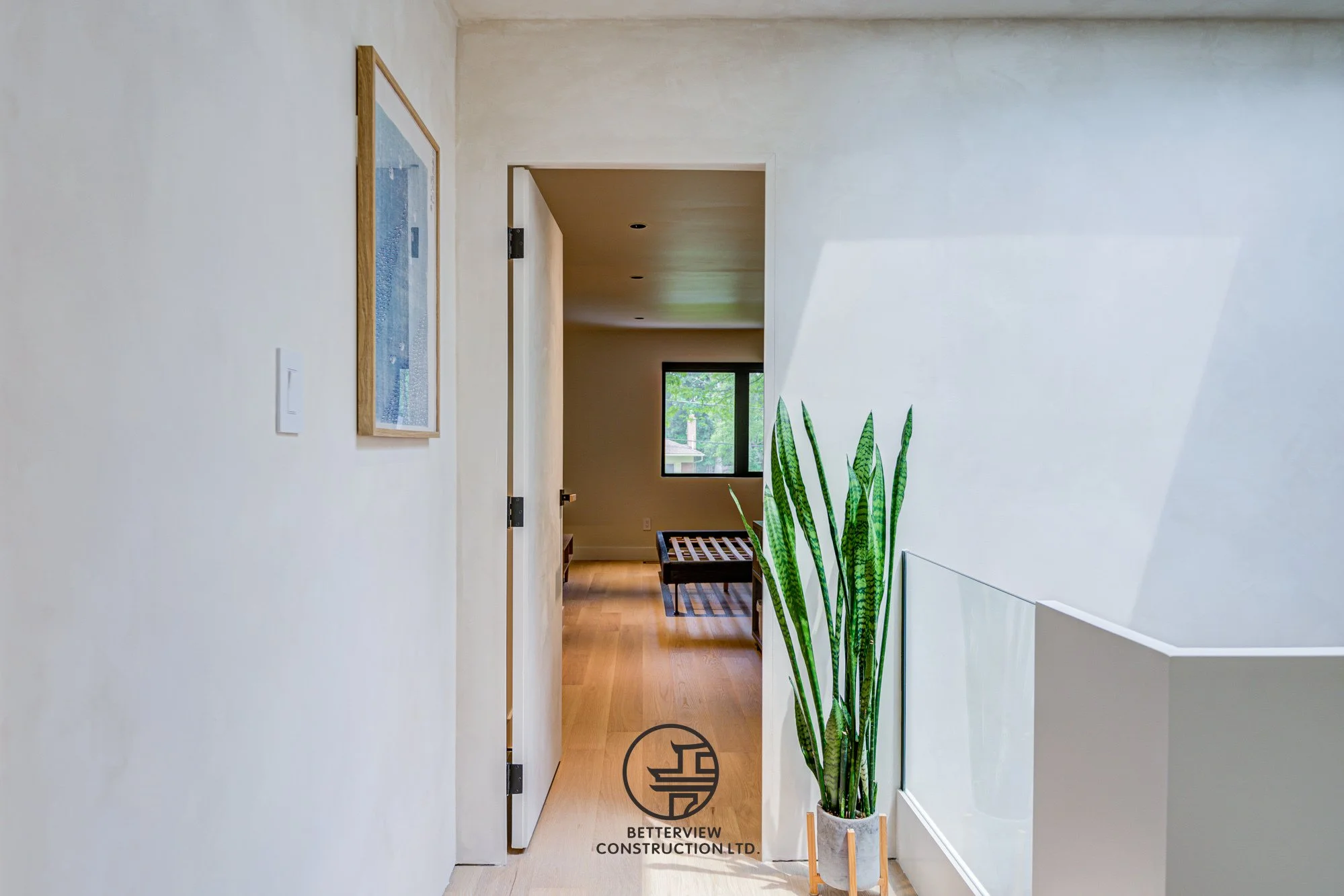 modern hallway leading to living room in a renovated Toronto home