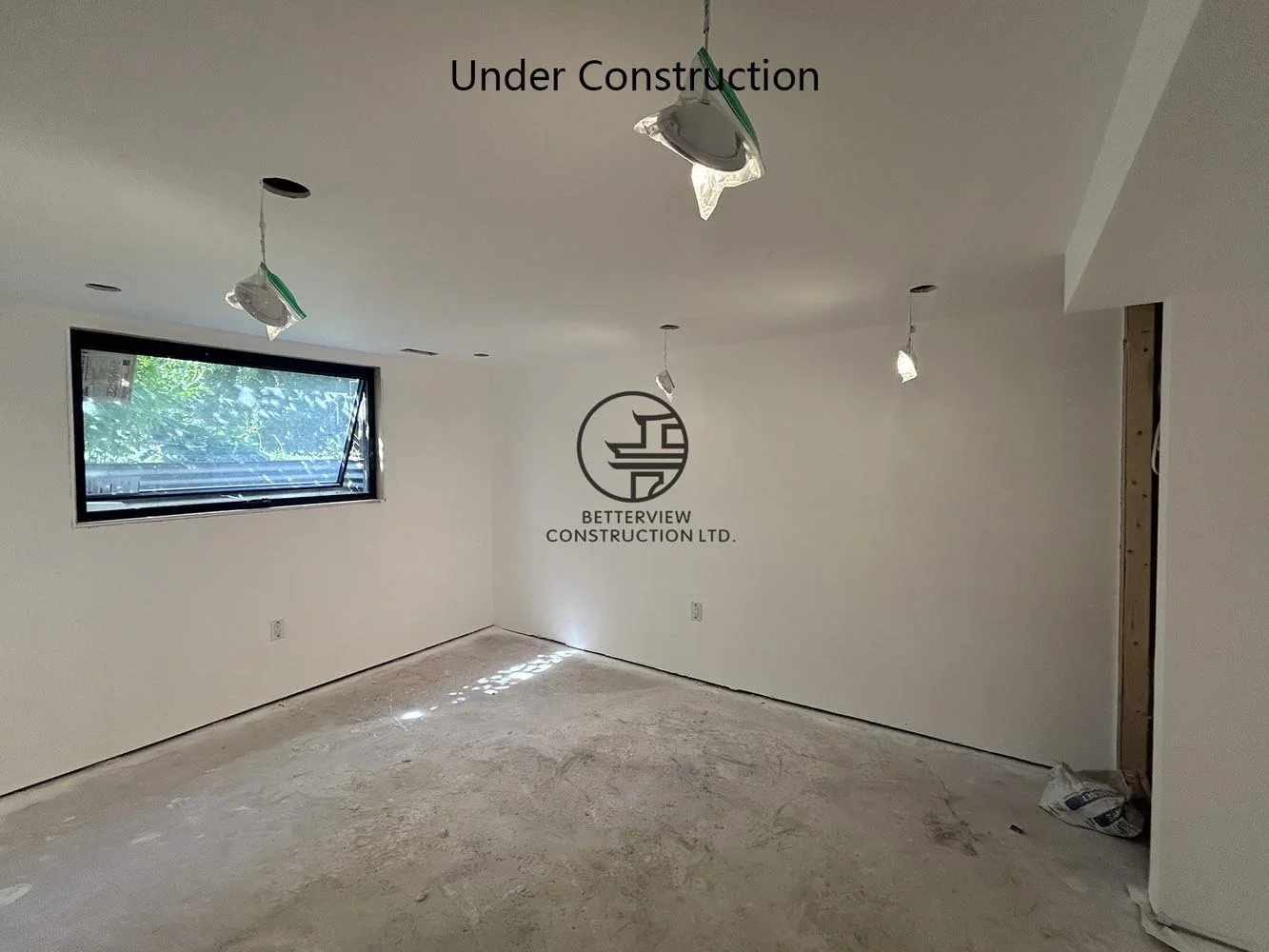Finished drywall in a newly built bedroom during a home renovation, ready for flooring, trim, and interior finishing.
