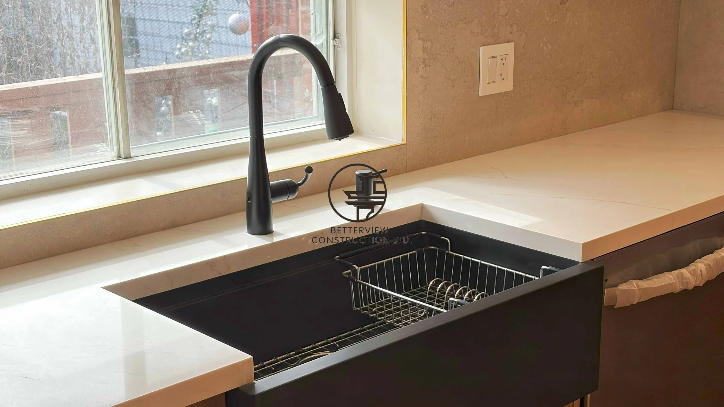 Modern kitchen renovation designed and built by Betterview Construction Ltd., featuring custom millwork cabinetry in warm natural wood tones, premium finishes, and a clean contemporary kitchen design, showcasing high-quality residential construction 