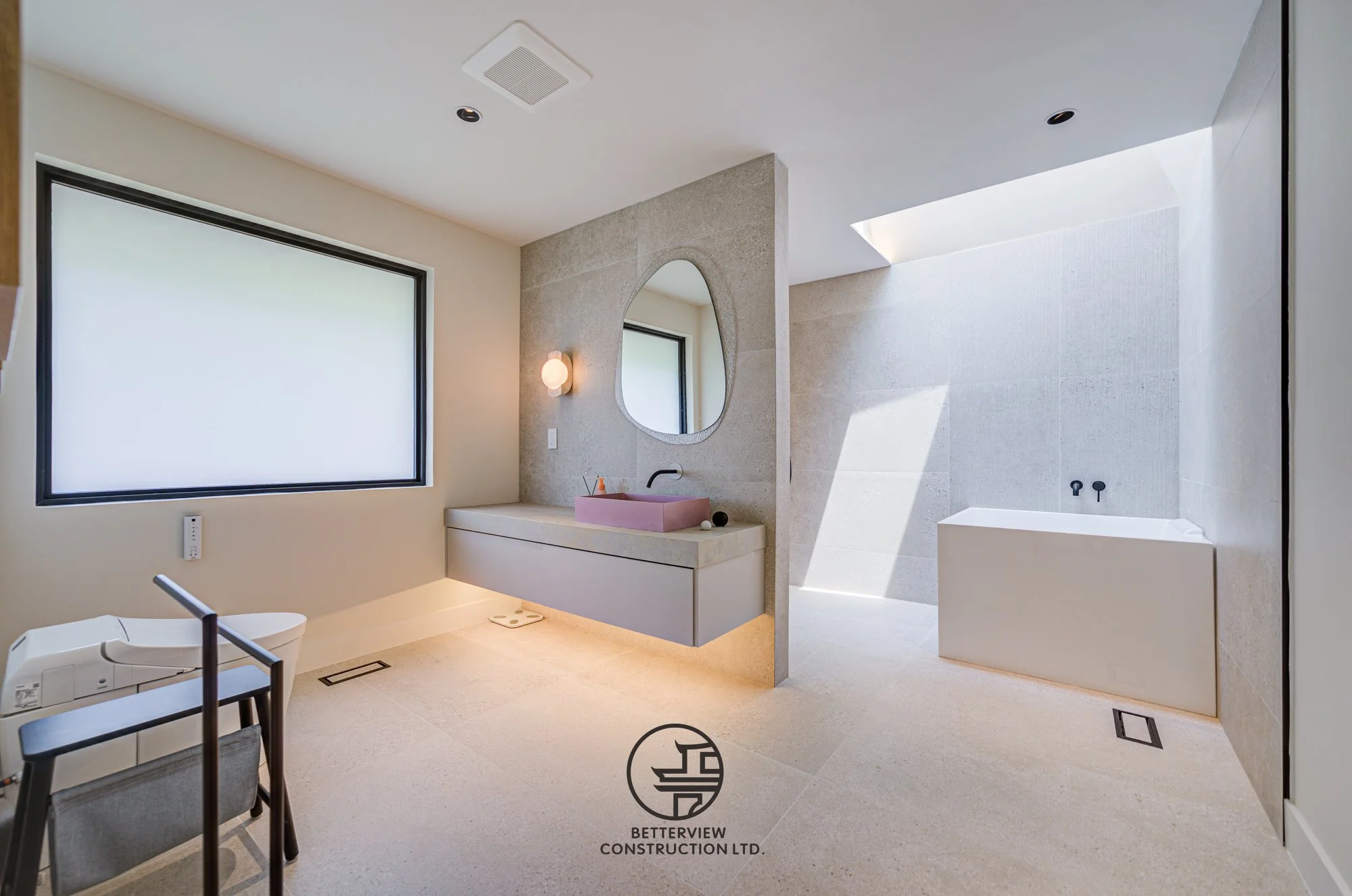 modern bathroom renovation with floating vanity, arch mirror and bathtub