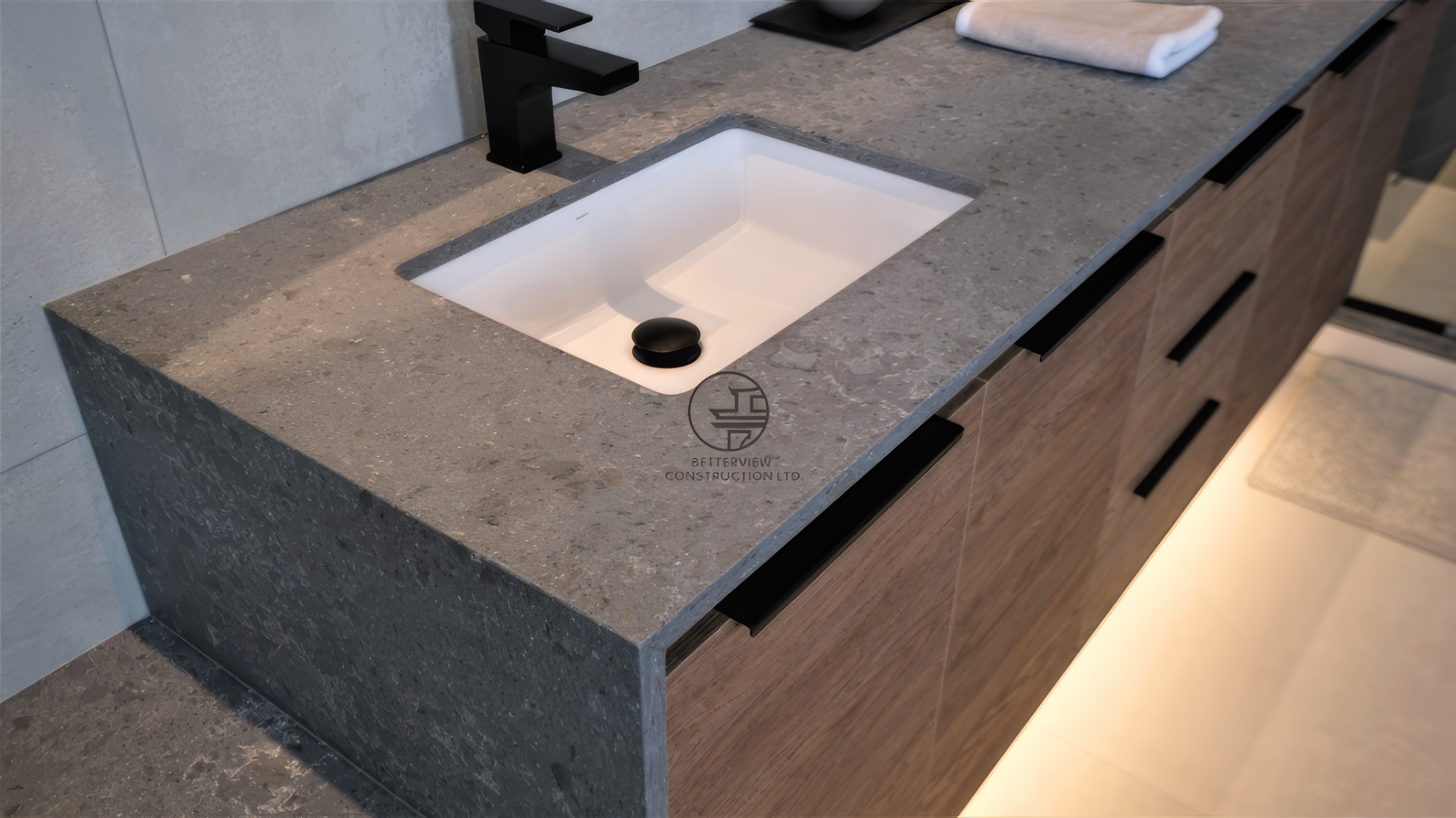 modern bathroom vanity with concrete countertop, undermount sink, and wood cabinetry