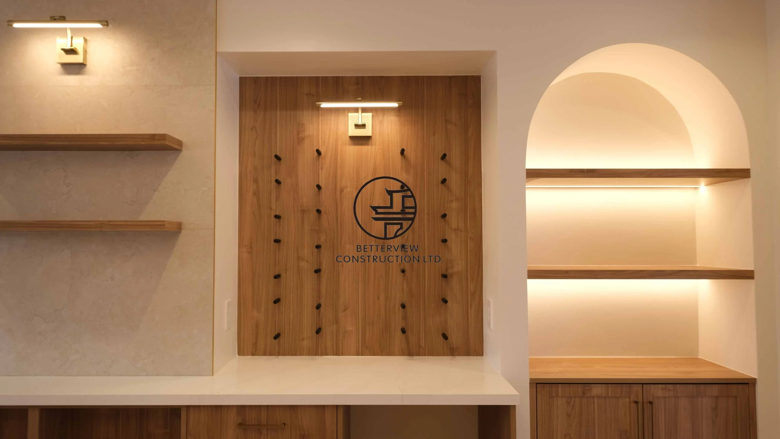 Modern open-concept living room and kitchen designed and built by Betterview Construction Ltd., featuring custom millwork and a clean contemporary interior design style, showcasing high-quality residential renovation, construction, and interior finis