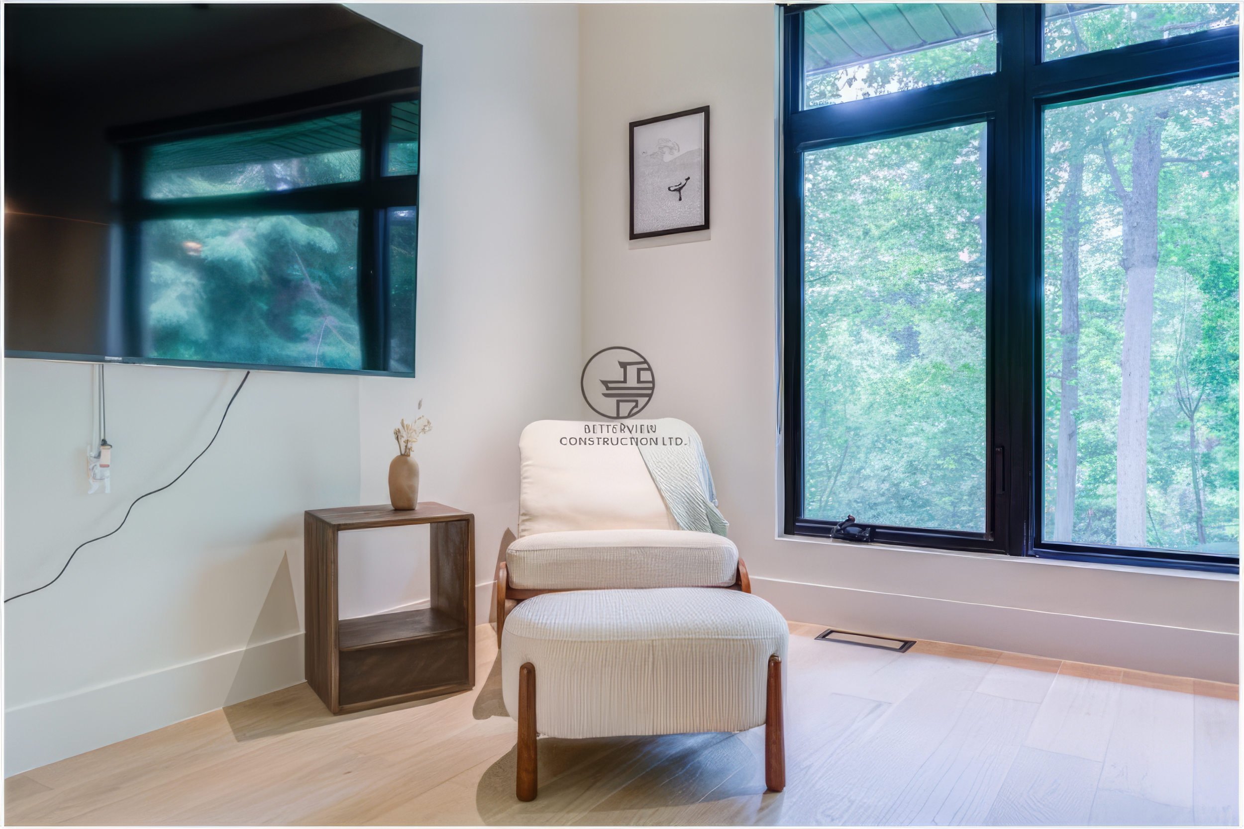 cozy seating corner in modern master bedroom with large window and natural light