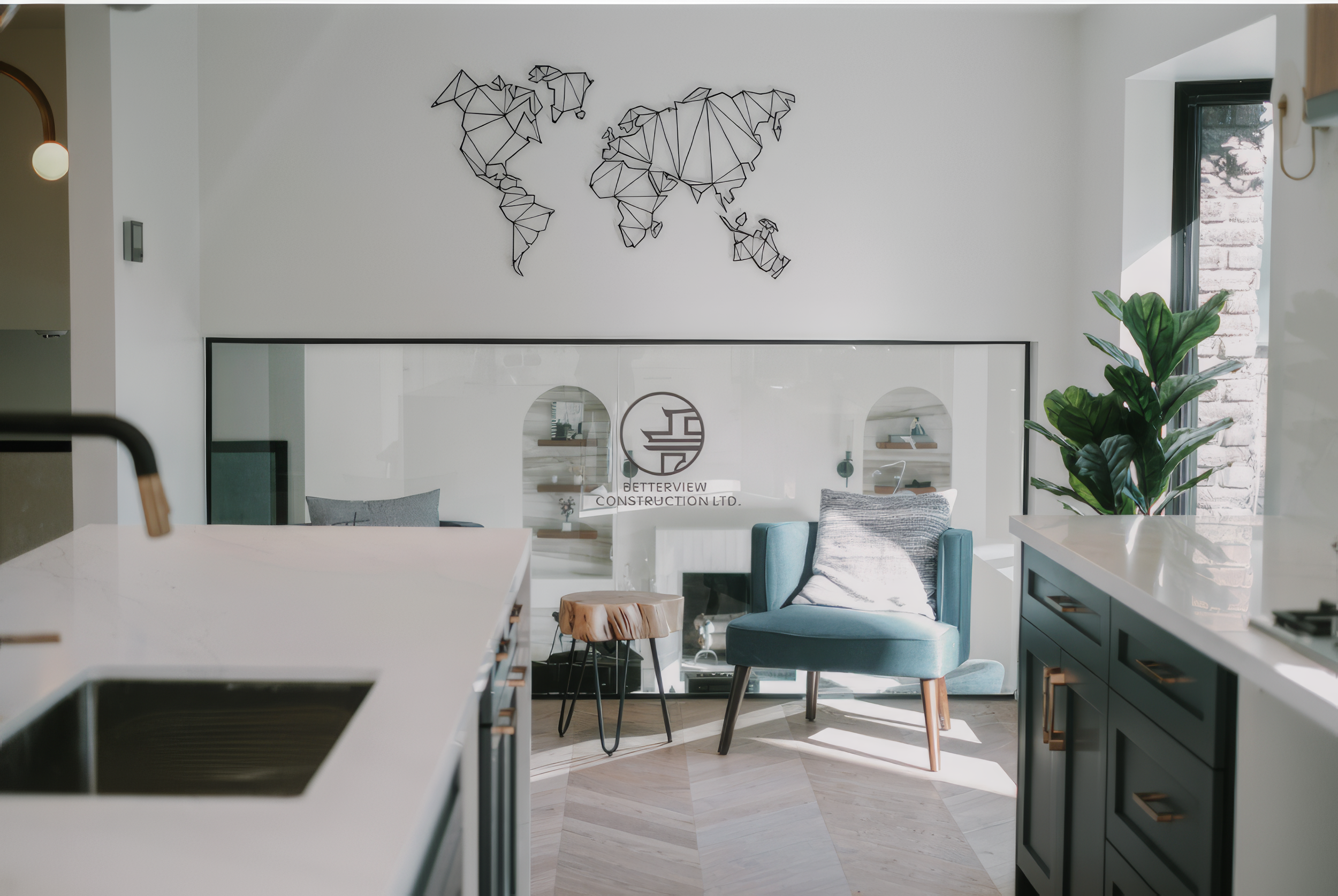 Modern kitchen renovation with white countertops, custom cabinetry, and open concept seating area in a Toronto home.