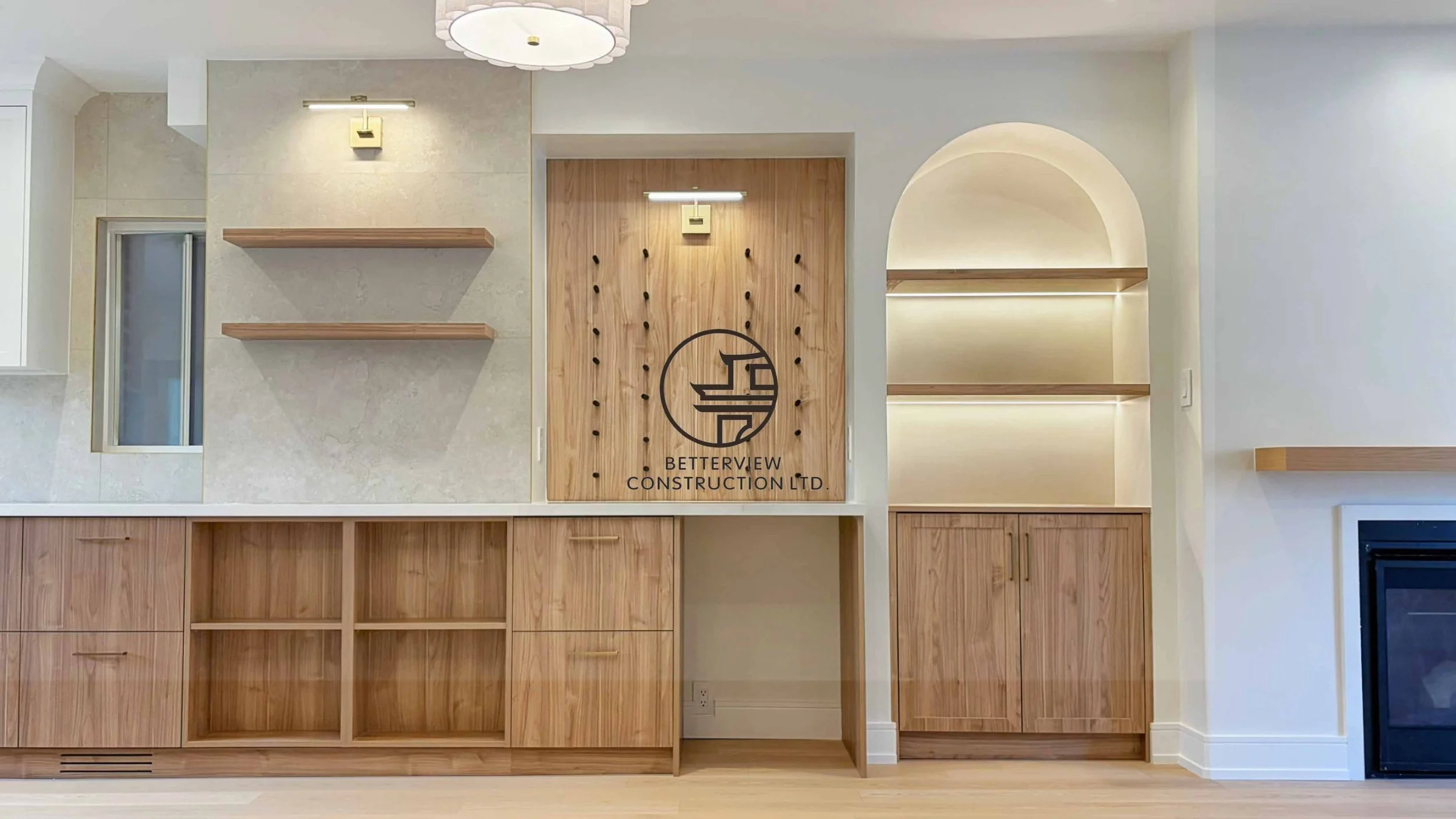 Modern open-concept living room and kitchen designed and built by Betterview Construction Ltd., featuring custom millwork and a clean contemporary interior design style, showcasing high-quality residential renovation, construction, and interior finis