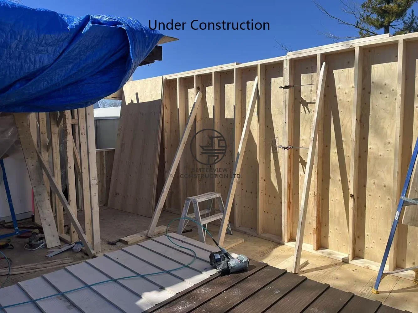 Structural framing for the rear addition, expanding the home's footprint while creating an open concept living space.