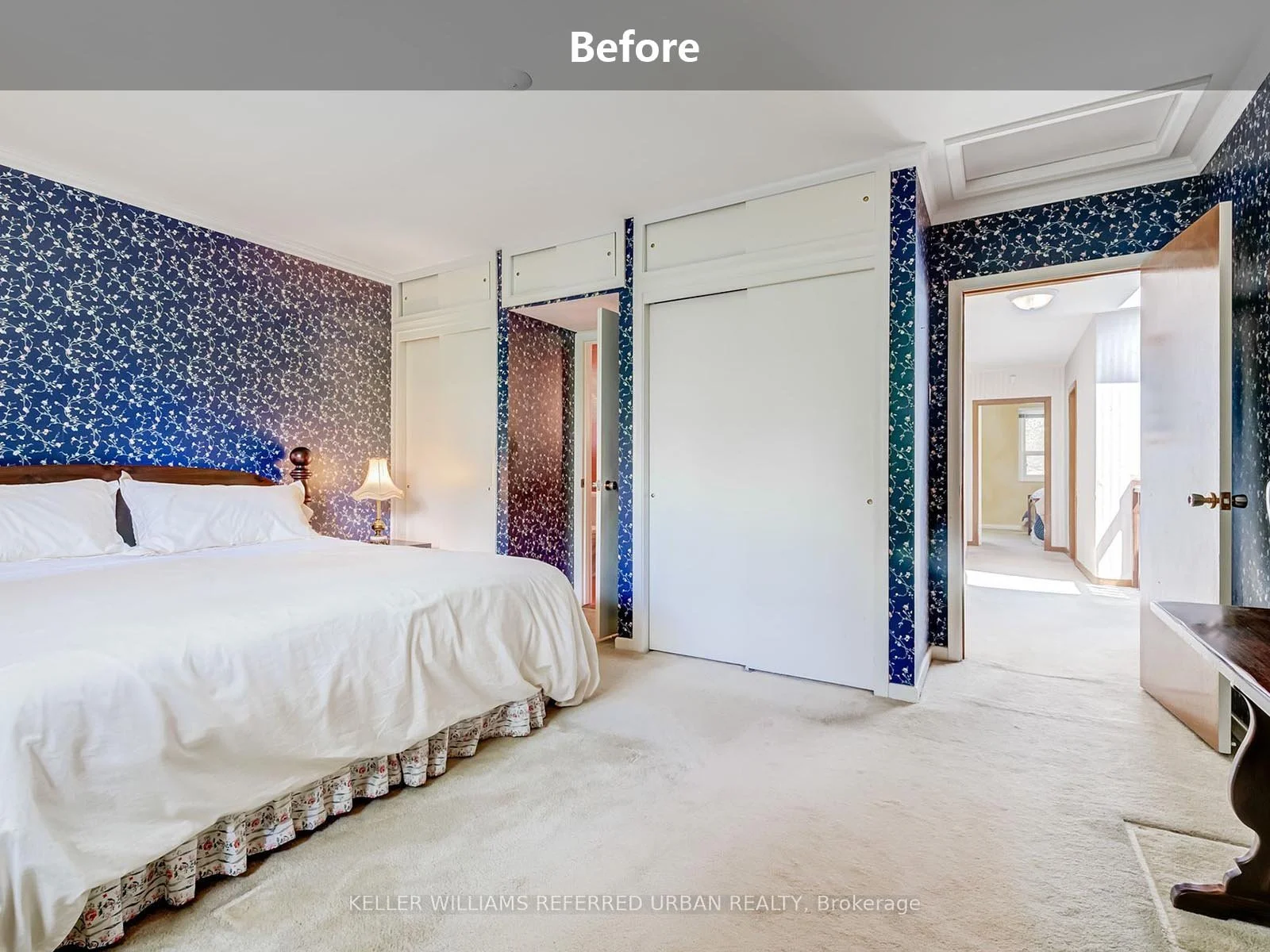 bedroom interior before renovation with patterned wallpaper and carpet flooring