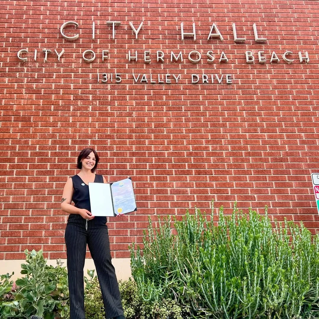 Millie at City Hall with Pride Proclimation-May 2024.jpg