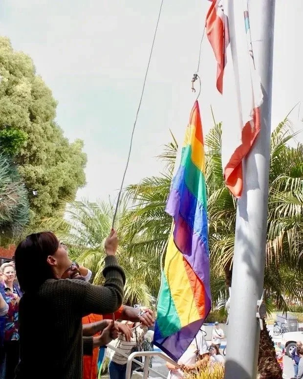 Hermosa+Beach+Pride-Millie+Raising+the+Pride+Flag+at+City+Hall.jpg