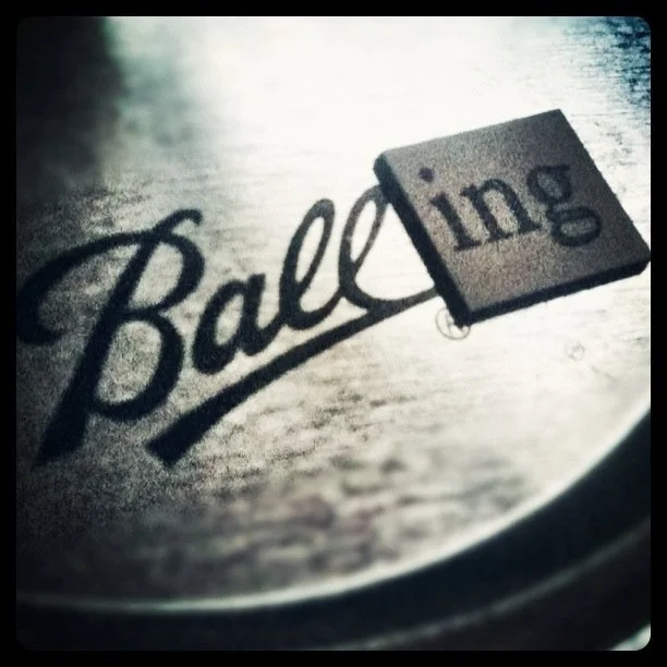 Close-up of a blackjack game showing the word 'Balding' with a partially covering card that has the word 'ling' visible.