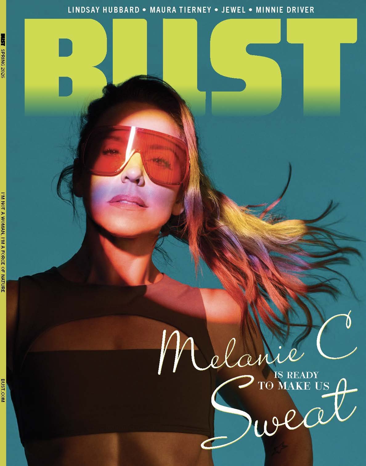 Magazine cover featuring Melanie C wearing futuristic red sunglasses and a black top with cutout design, with her hair blowing to the side. The magazine title is 'BUST' in bold green letters, and there is text indicating it is the Spring 2026 issue. Additional headlines mention Lindsay Hubbard, Maura Tierney, Jewel, and Minnie Driver.