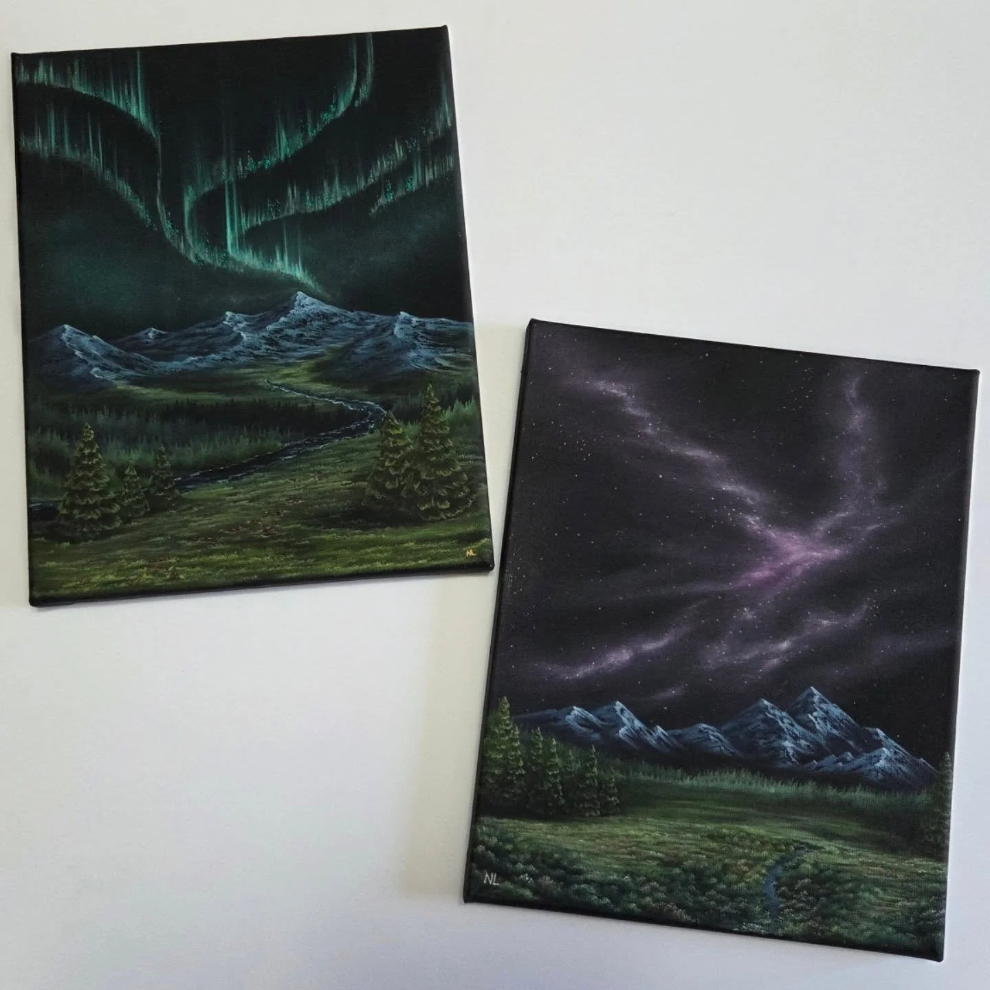 I'm putting the final varnish on these guys today and I am so ready because they're going to our local fair!

Transcendence (purple sky) and Transformation (green aurora) are a pair of paintings that I did together. My goal was to try out a galaxy sk