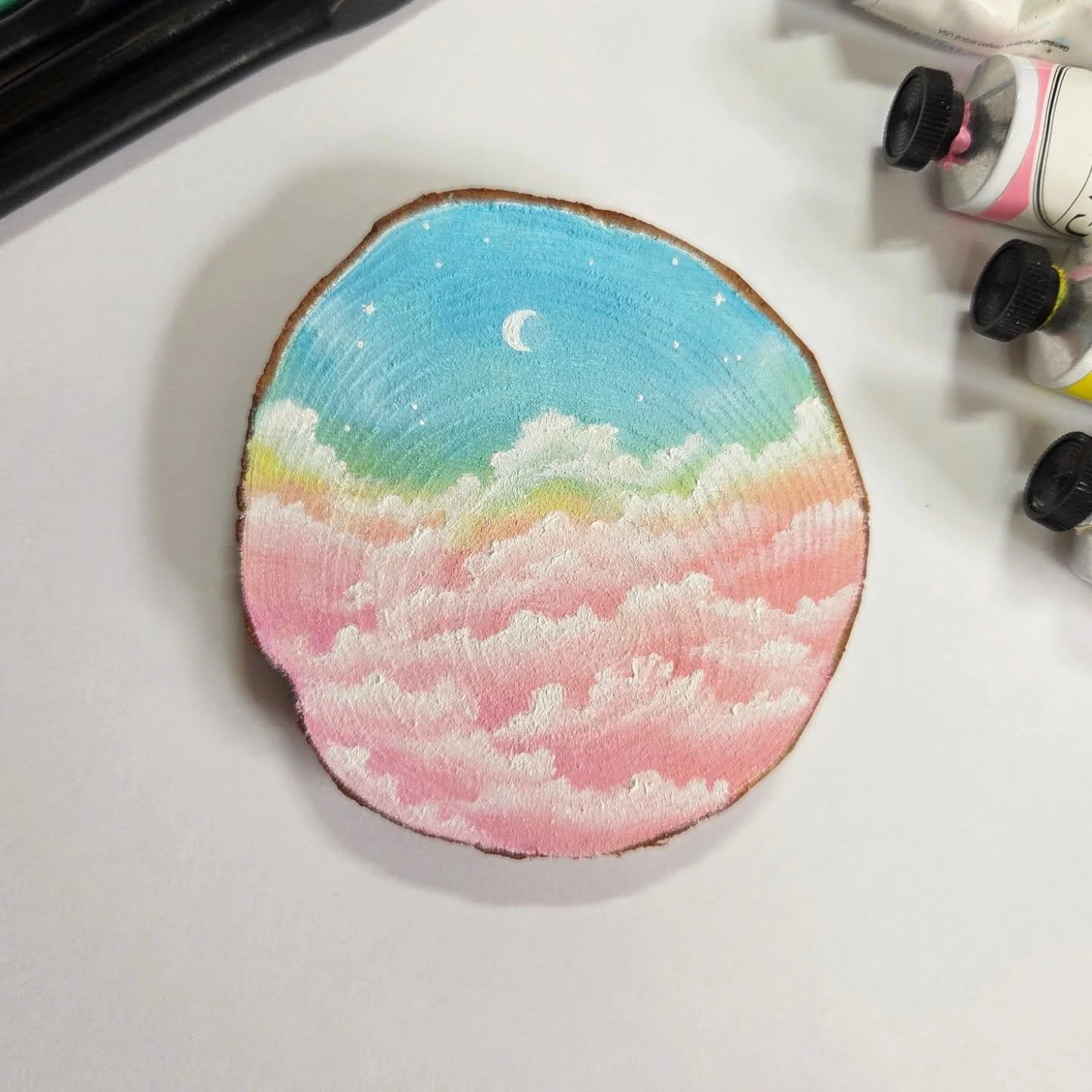 Something a little pastel. I broke out the radiant line of paints for this one.

I usually coat these to make sure the wood doesn't absolutely fall apart, because the raw edge loves to flake off. That takes a bit to do, so it's on pause until the las