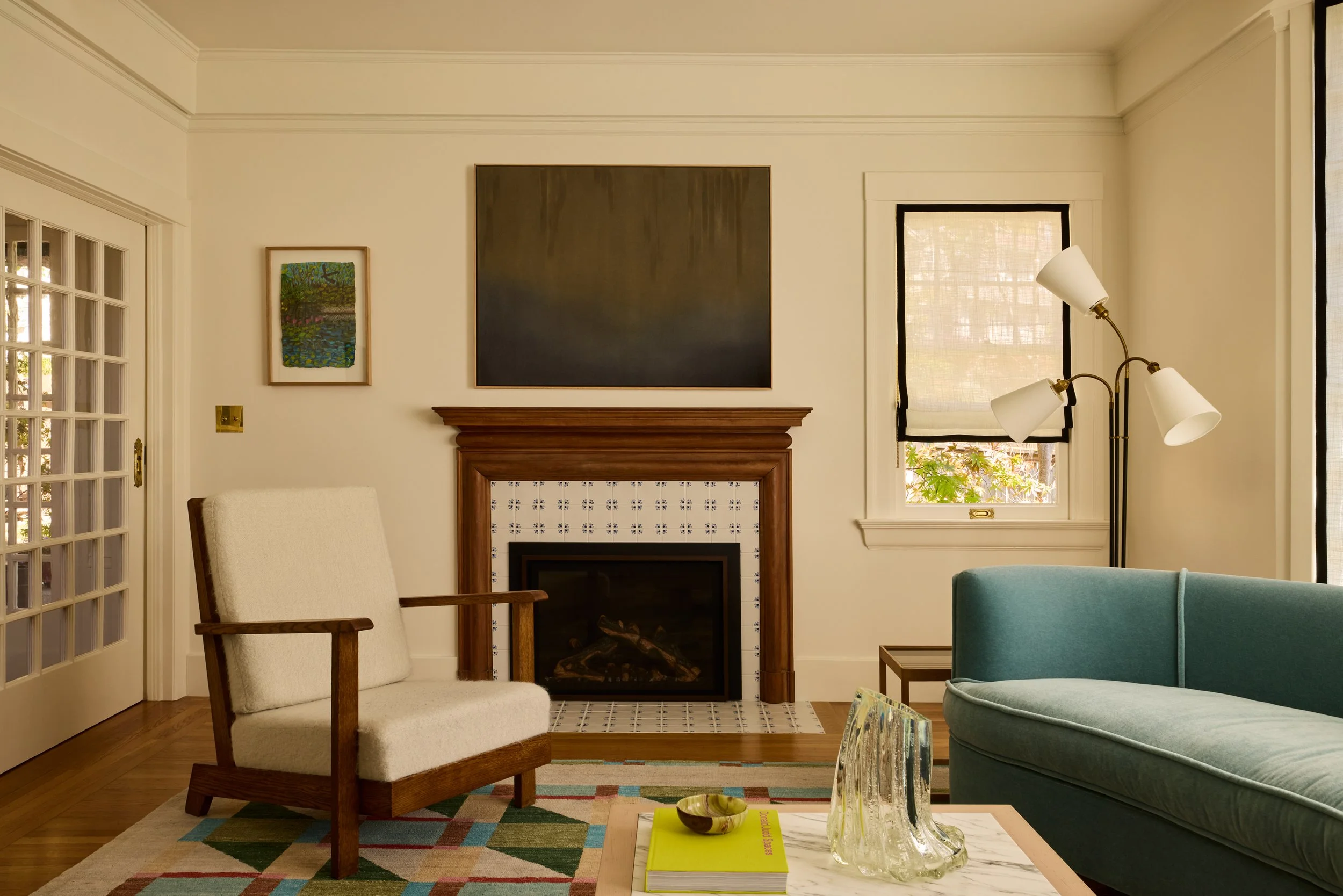 studio trovato antique fireplace, vintage chairs and custom sofa