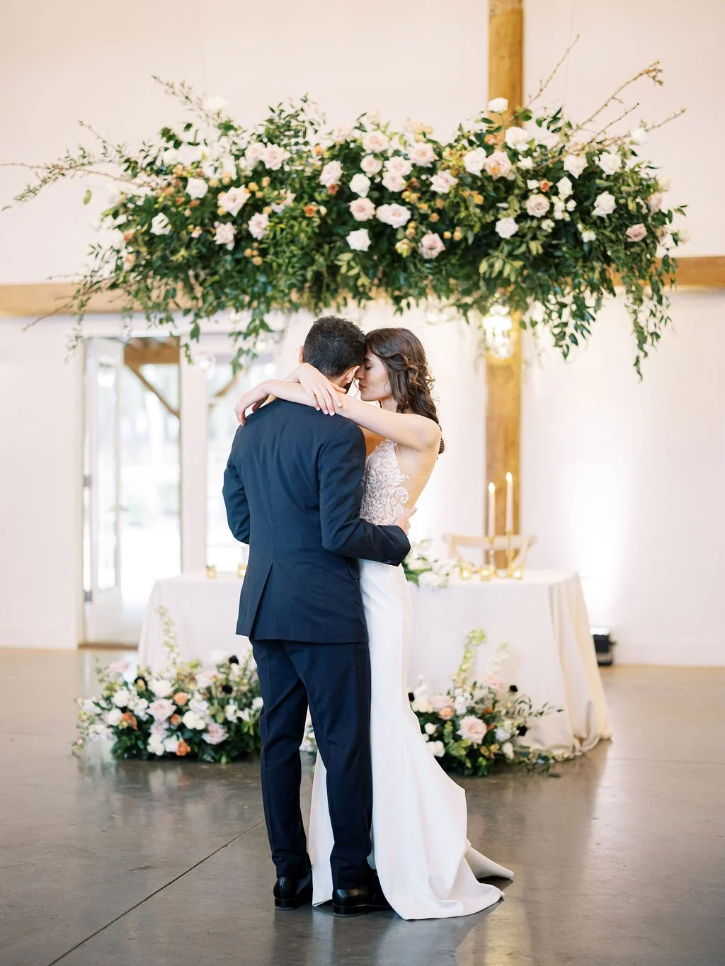 Organic hanging floral chandelier installation at The Barn of Chapel Hill wedding venue