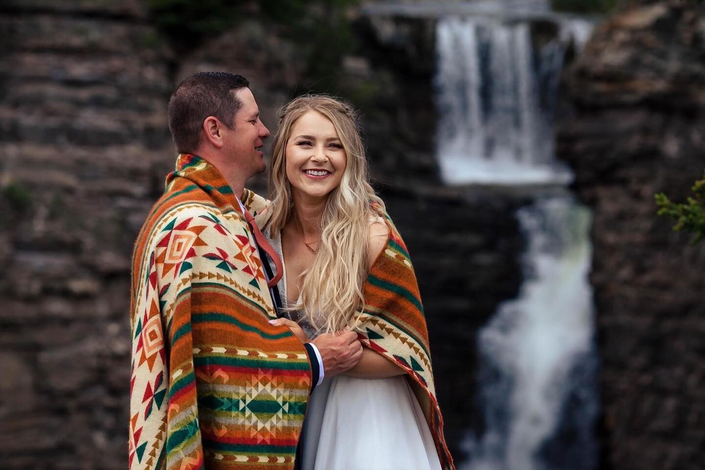 That waterfall, that blanket, and those smiles! This wedding was a dream!