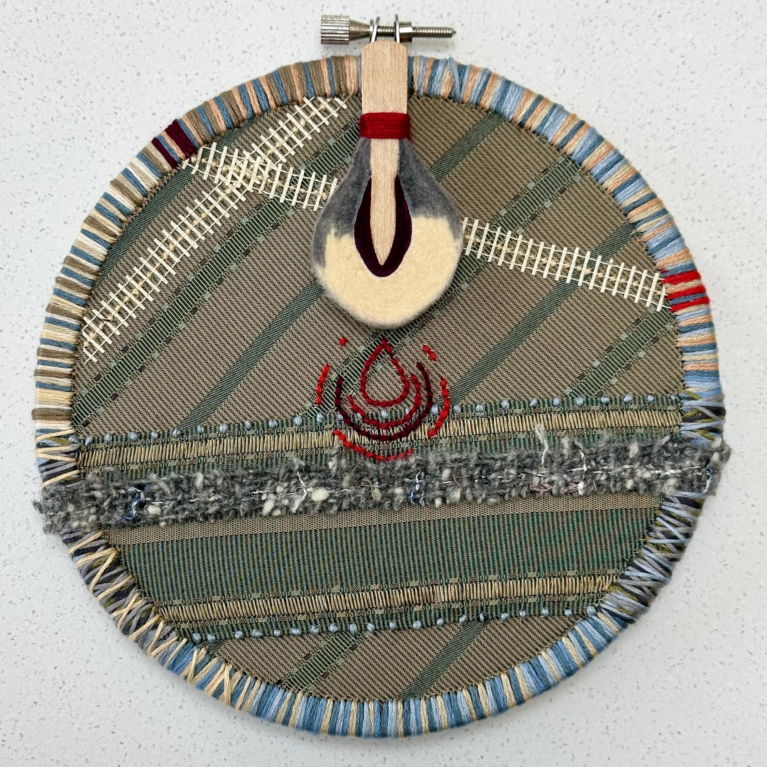 Resonance (2024) embroidery thread, trim, mesh and vintage piano hammer on upcycled fabric 6.5" disc $