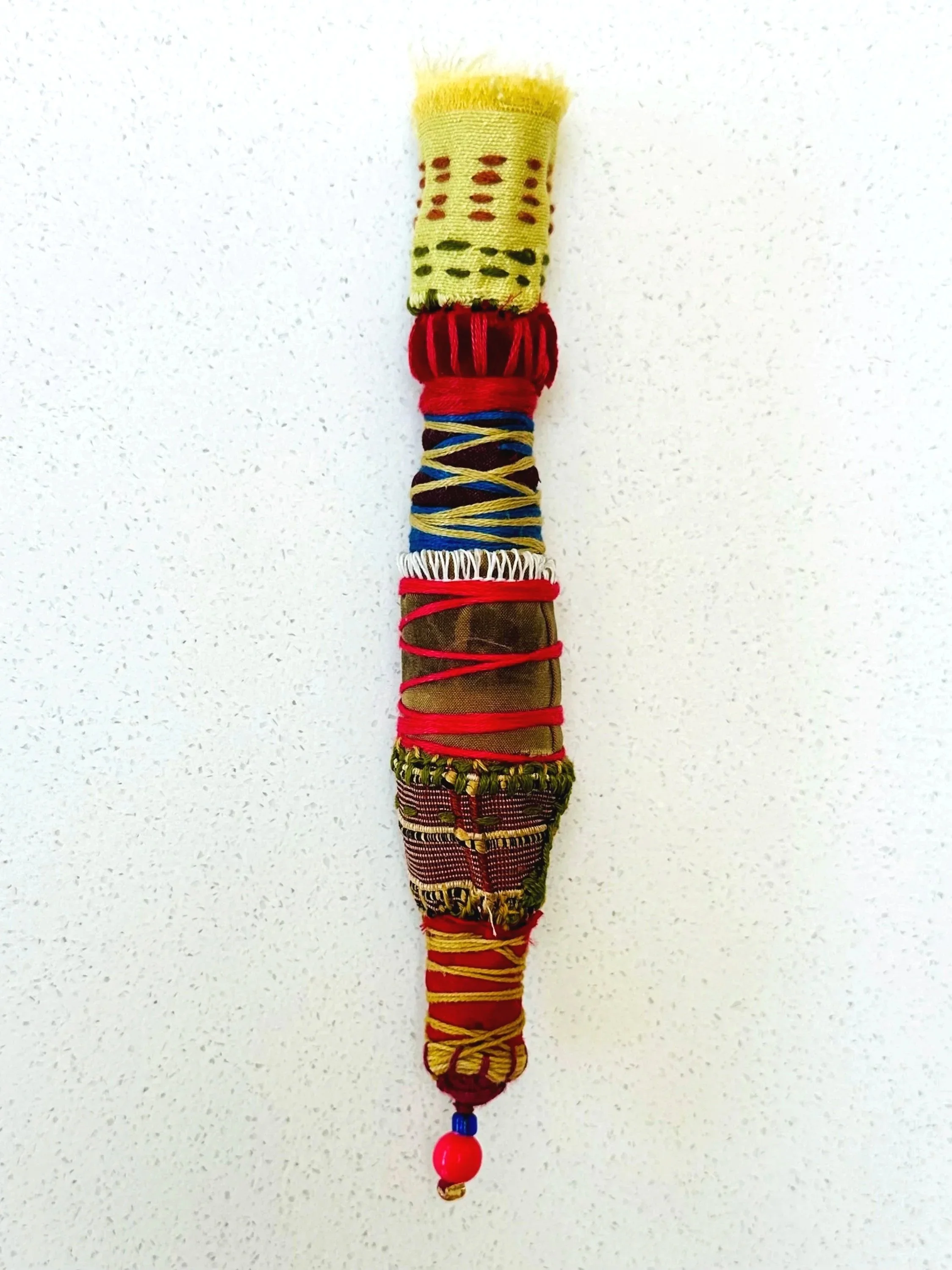 Exploration in Progress  (detail)   (2025)   6" - 12" x 1"  felt, upcycled fabric, beads, Sashiko thread, embroidery thread  