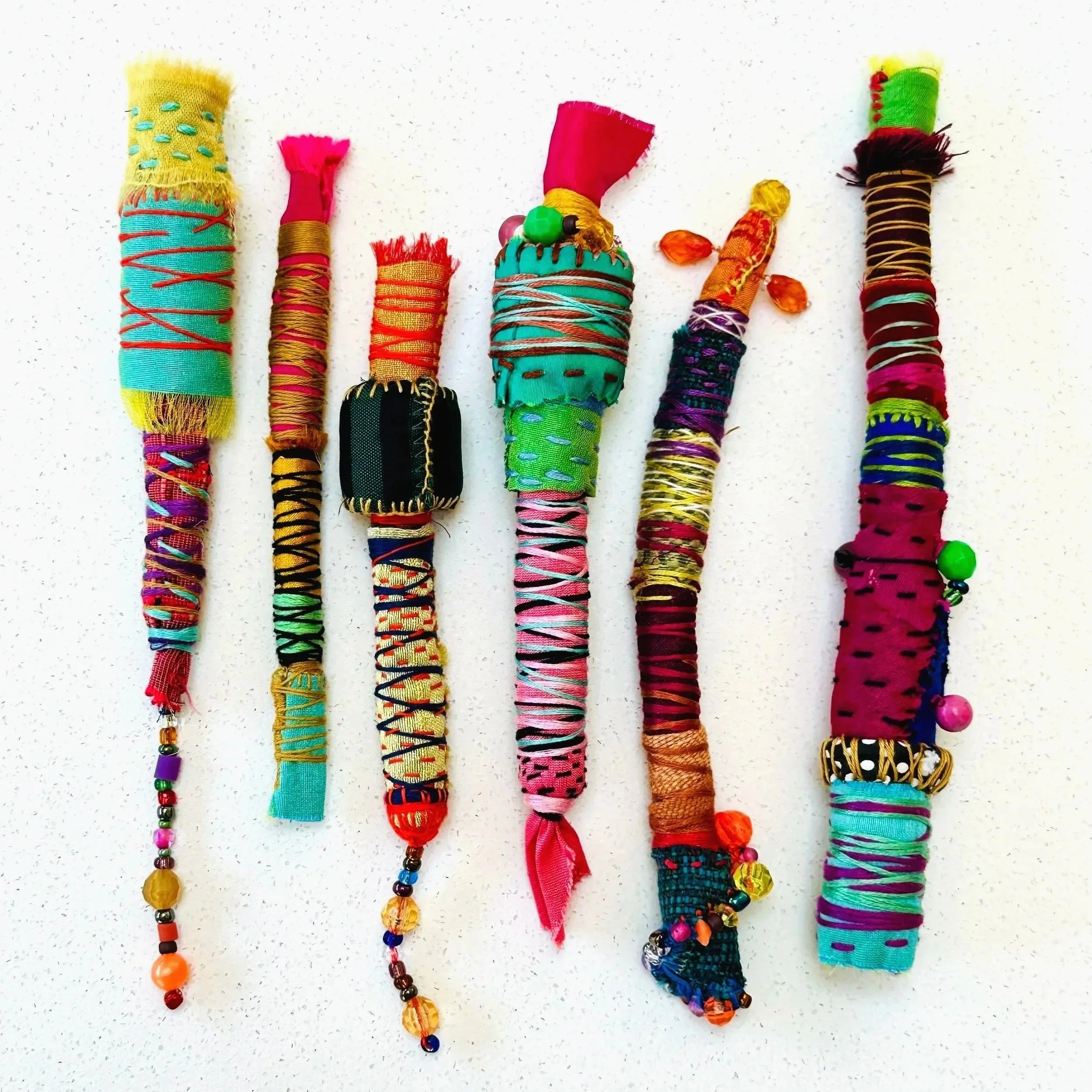 Exploration in Progress  (detail)   (2025)   6" - 12" x 1"  felt, upcycled fabric, beads, Sashiko thread, embroidery thread  