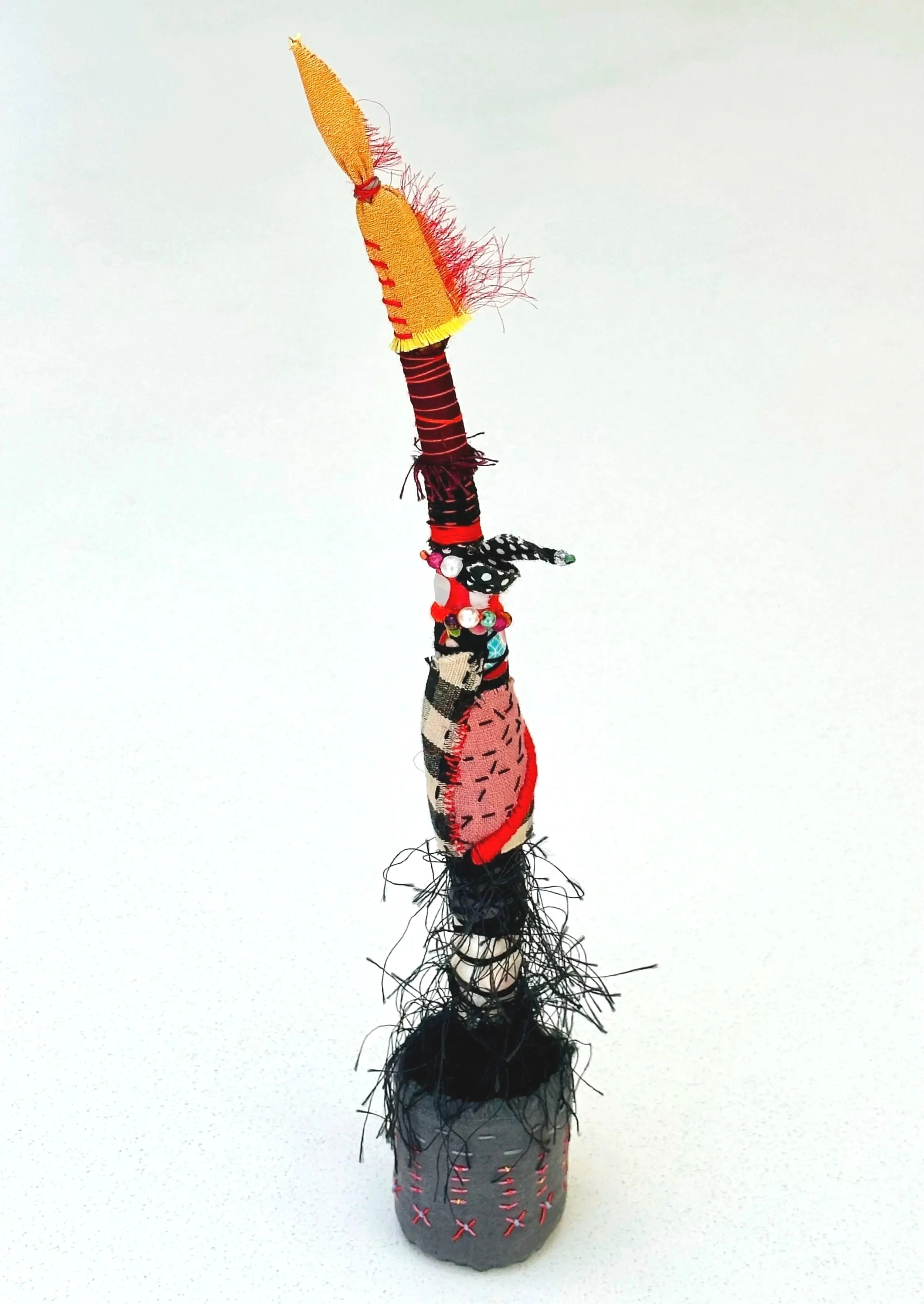 Sizzle   (freestanding)   (2025)   felt, upcycled fabric, beads, Sashiko thread, embroidery thread, yarn   13" x 3" x 2.5"  $500