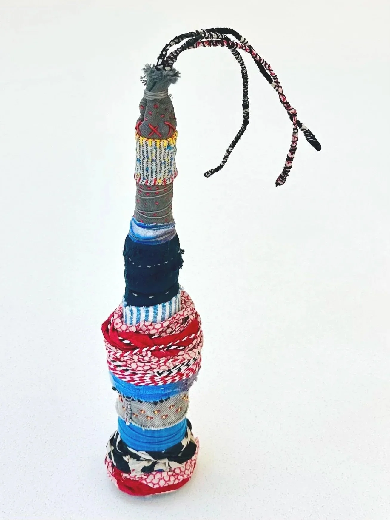 Corseted  (freestanding)   (2025)   felt, upcycled fabric, trim, twine, Sashiko thread, embroidery thread, yarn  12" x 3" x 5"  $450