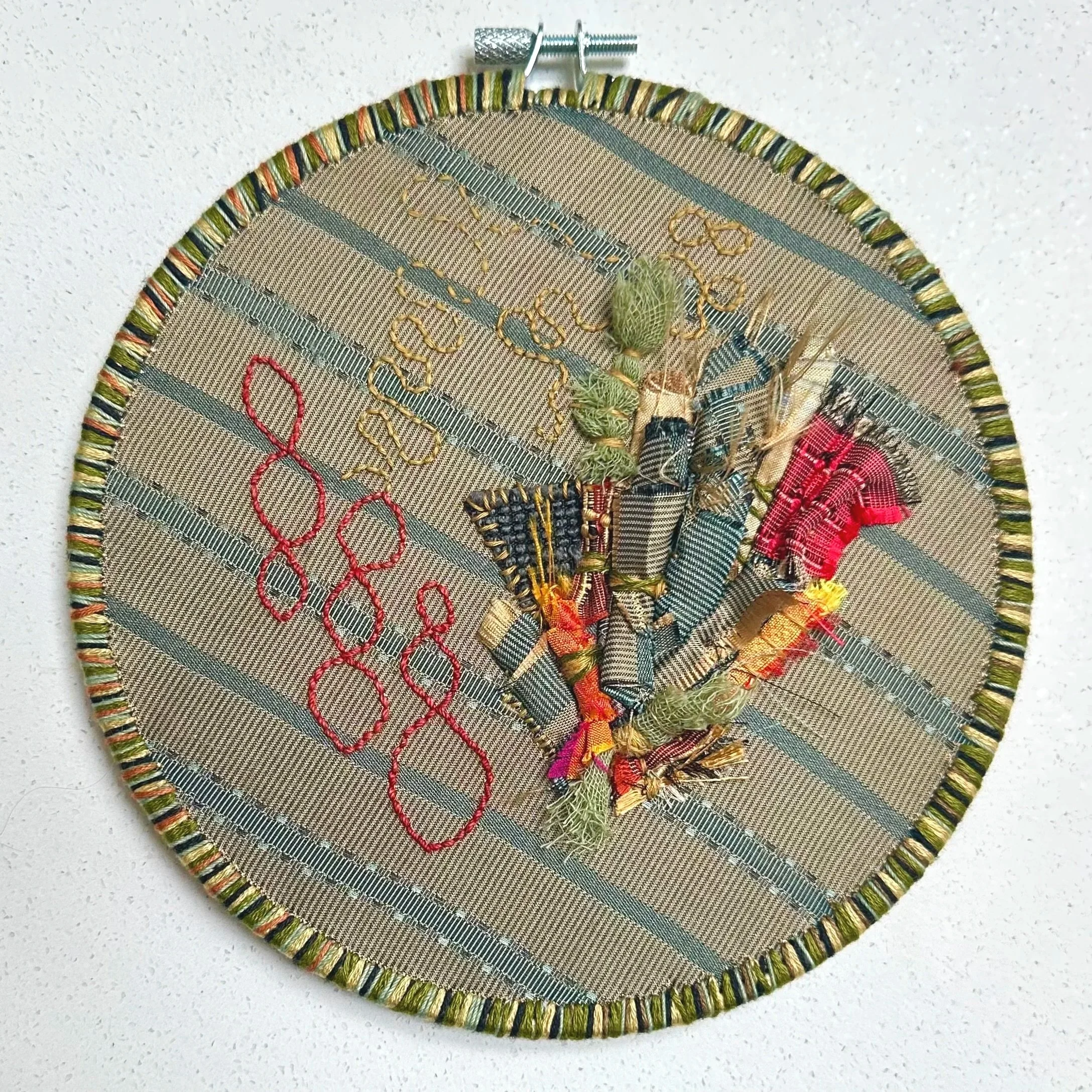 Infinate Bundle   (2025)   upcycled fabric, Sashiko thread, embroidery thread   7.5"   $500