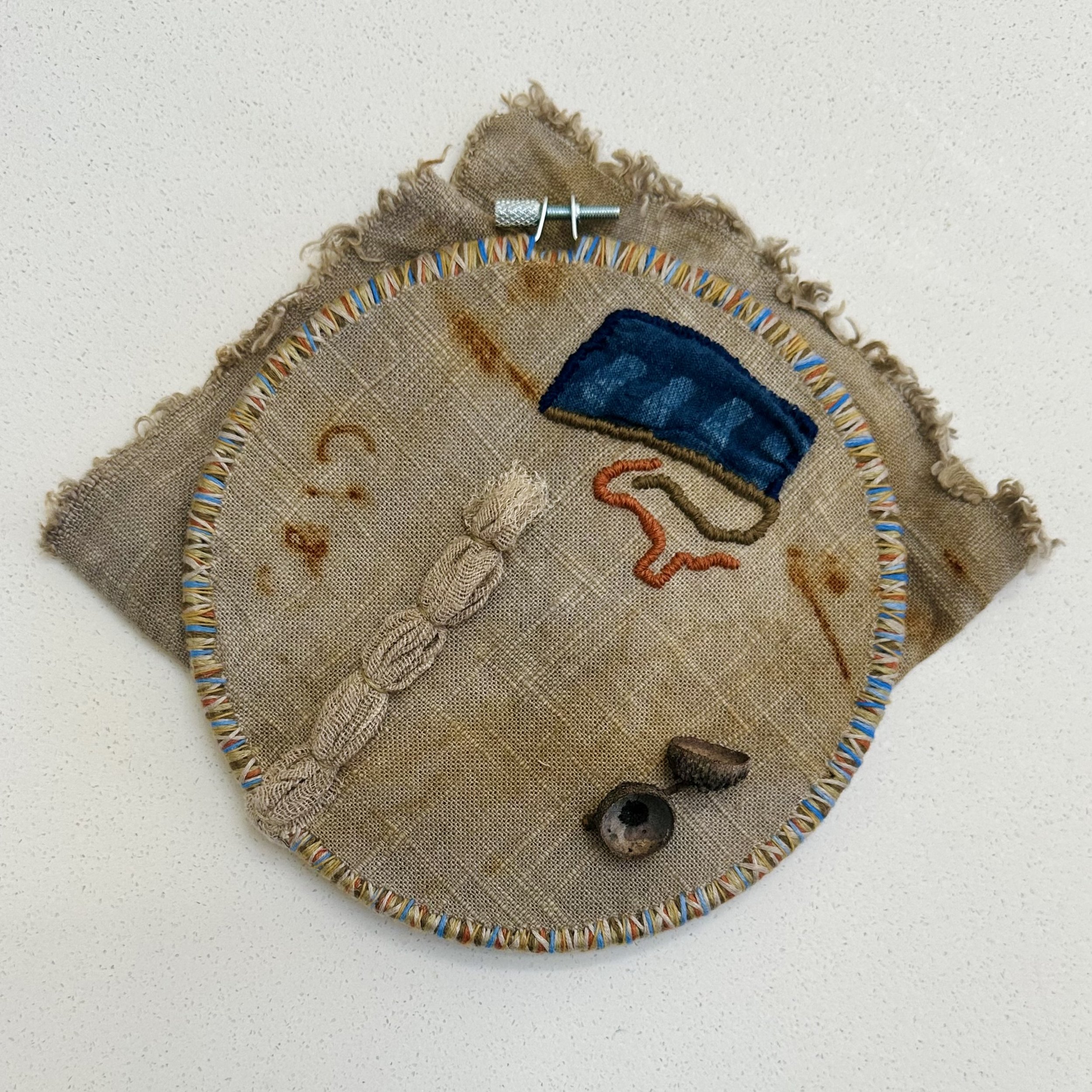 Pause (2025) Sashiko thread, embroidery thread, and acorn caps on gifted tea and rust dyed fabric and hand dyed fabric from Japan 8.5" x 10" $