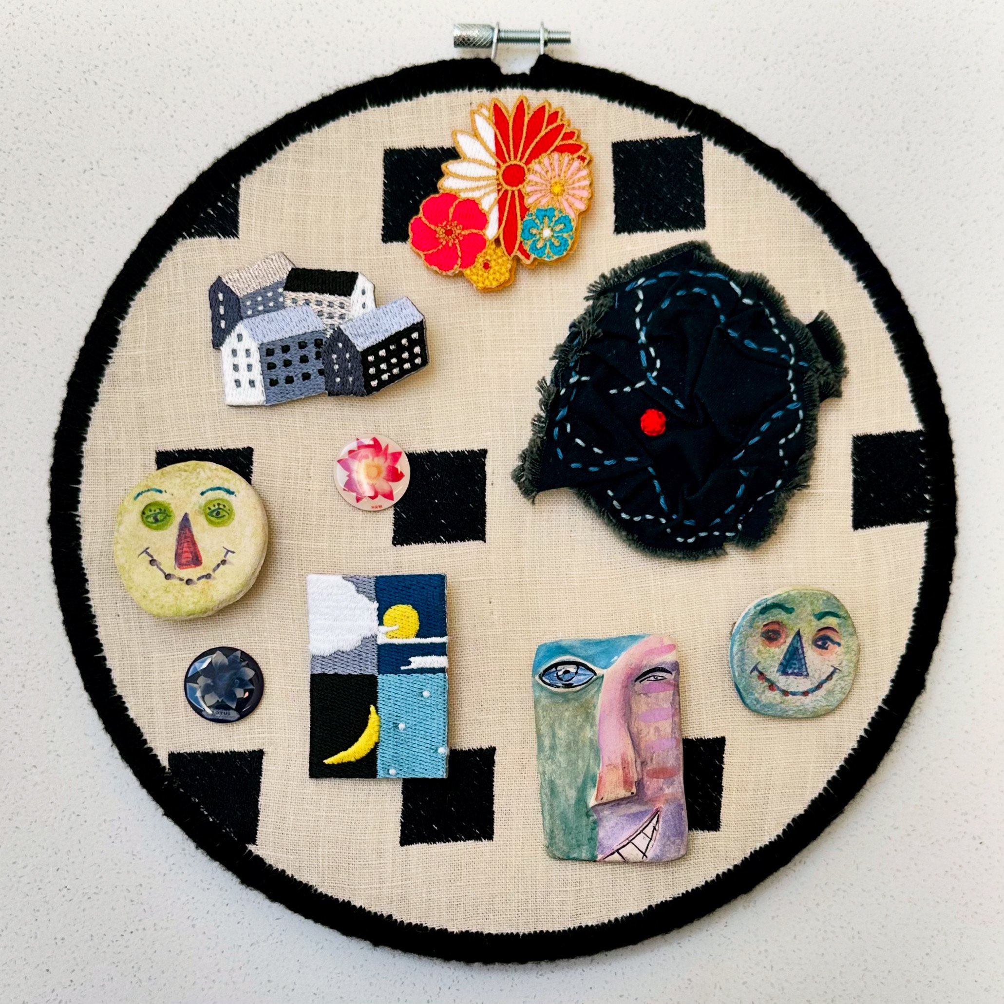 Random Function/Storage Unit (2024) fabric, embroidery thread, pins from Japan, hand painted ceramic pins by Elaine Scheer from the past, and one brooch by me 9.5" disc not available