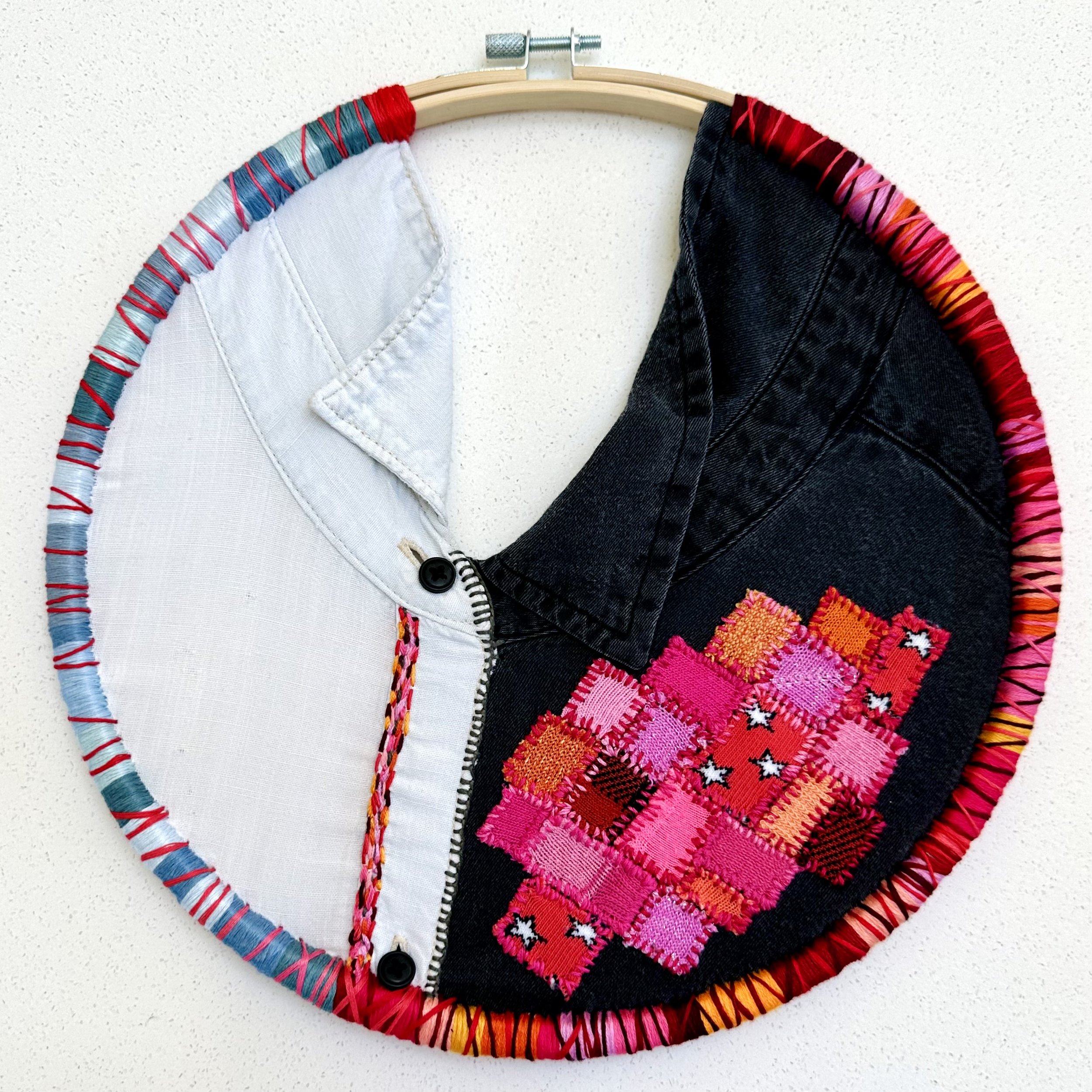 Collaged Connection (2023) embroidery thread on old shirts and socks 10.5" disc $