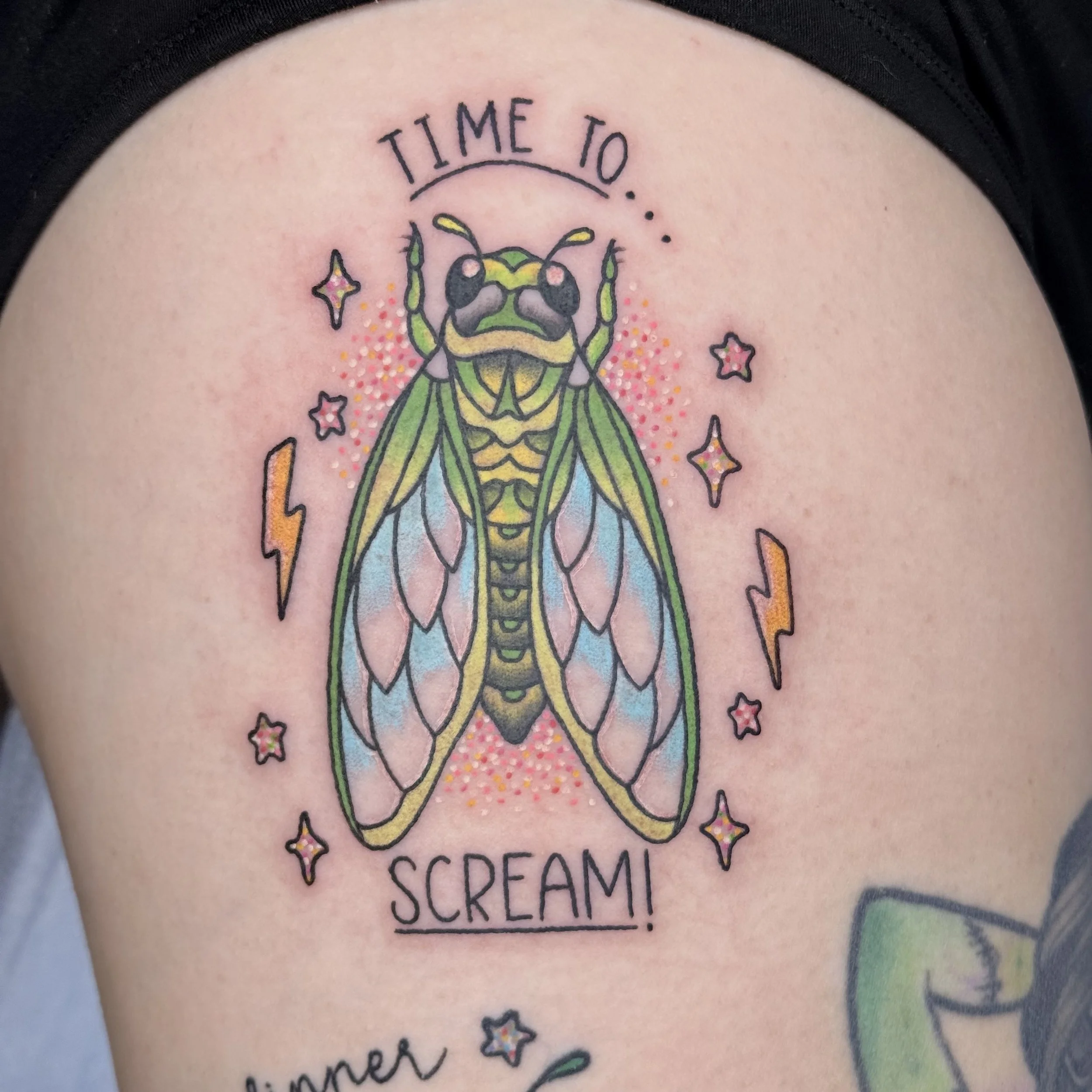 Colorful tattoo of a cicada with pastel wings, surrounded by stars and lightning bolts, with the text "Time to... Scream!" above and below.
