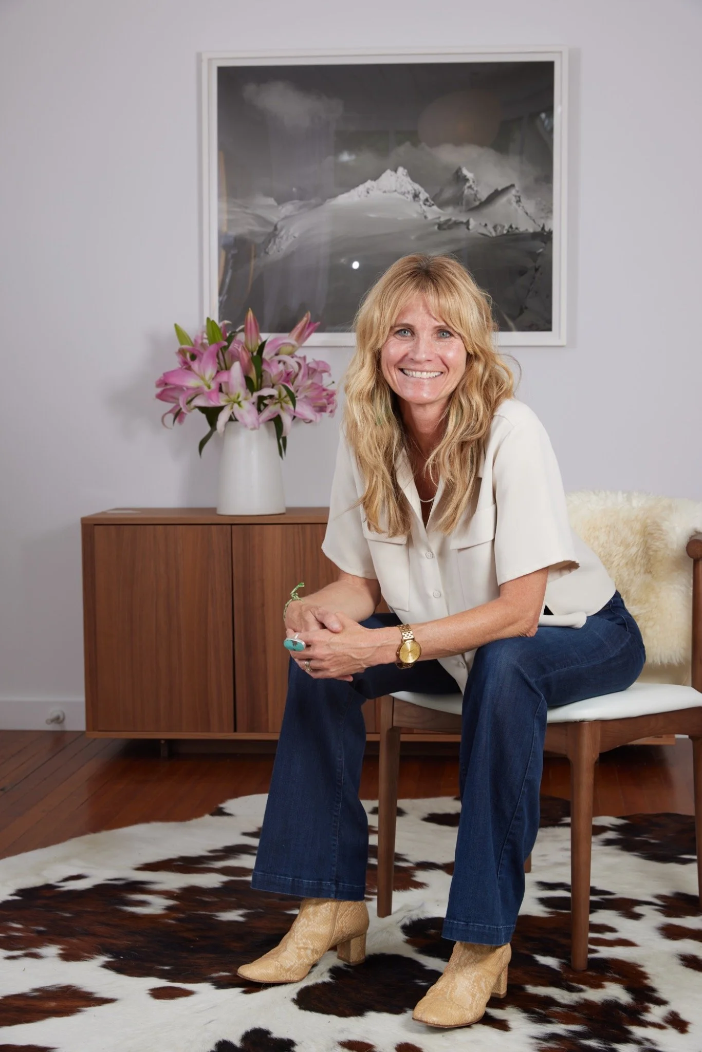 Kate Kripke standing in a white blouse, professional portrait