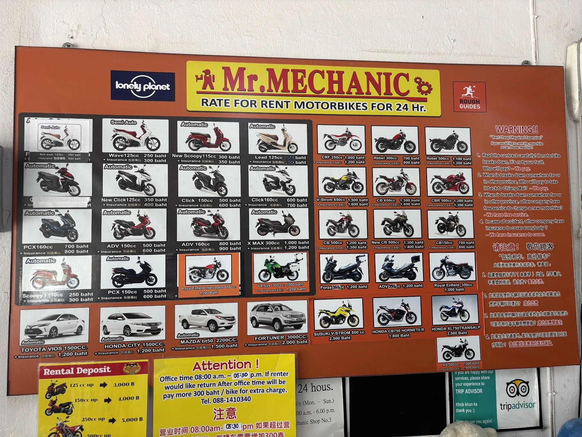 Signage in Mr Mechanic motorbike rental shop in Chiang Mai shows a variety of bikes for rent and shop policies