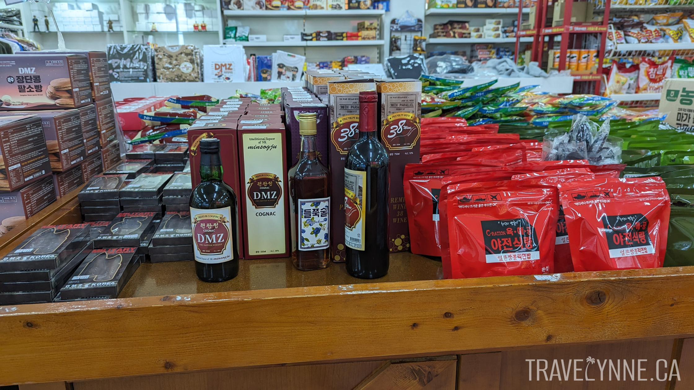 DMZ gift shop items including DMZ cognac and other liquors, and DMZ "rations"