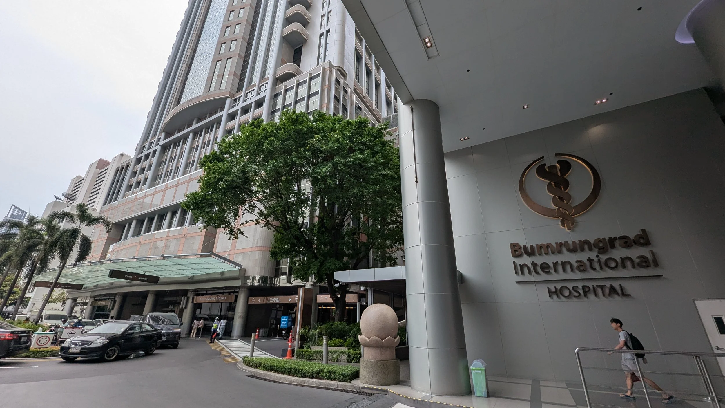 Cars dop off and pick up patients at Bumrungrad International Hospital in Bangkok, Thailand