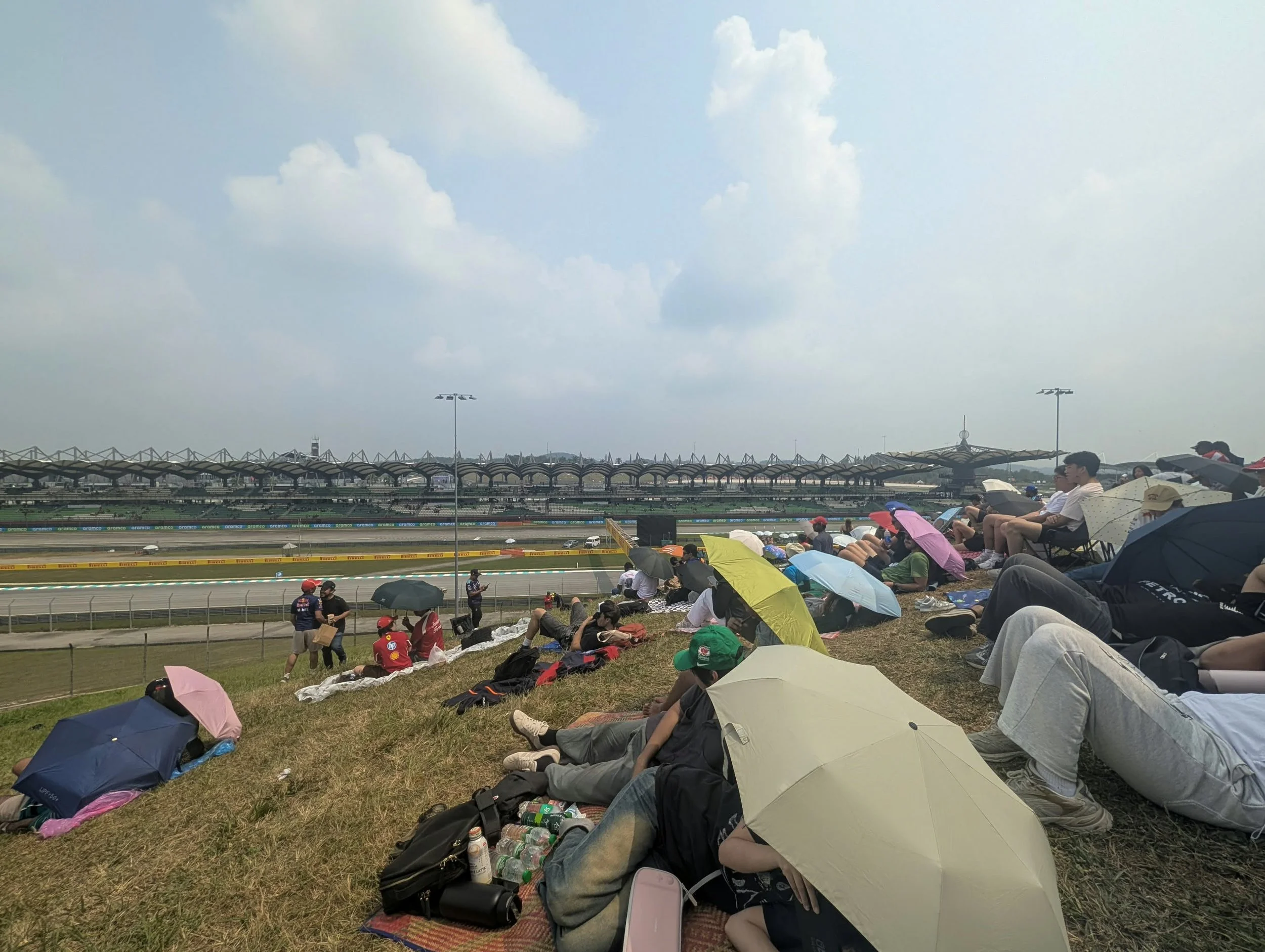 F1 Bahrain spectators watch from the hillside area in Sepang, Malaysia during the Grand Prix in October 2026.