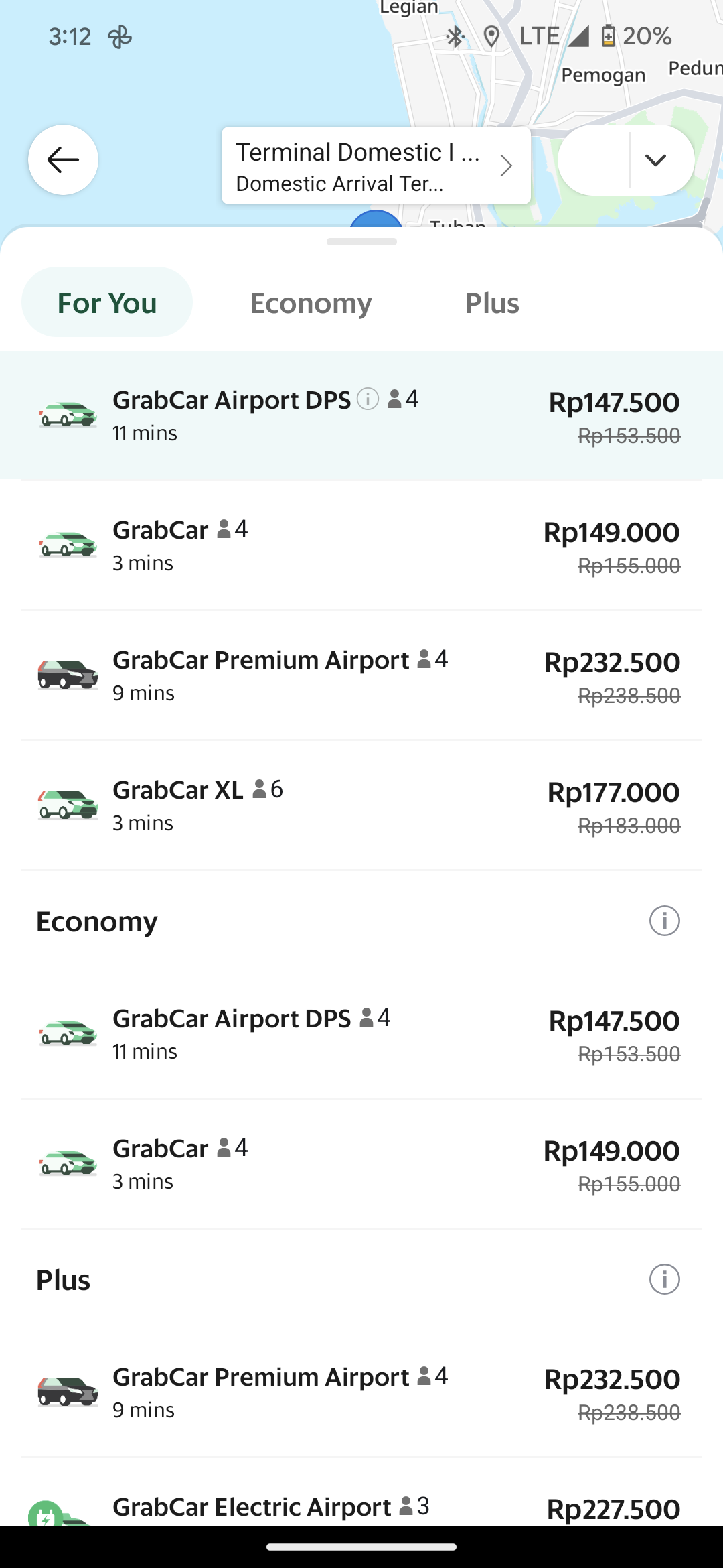A screenshot of the Grab app, showing the different car options and prices. The top option is GracCar Airport DPS Rp147.500