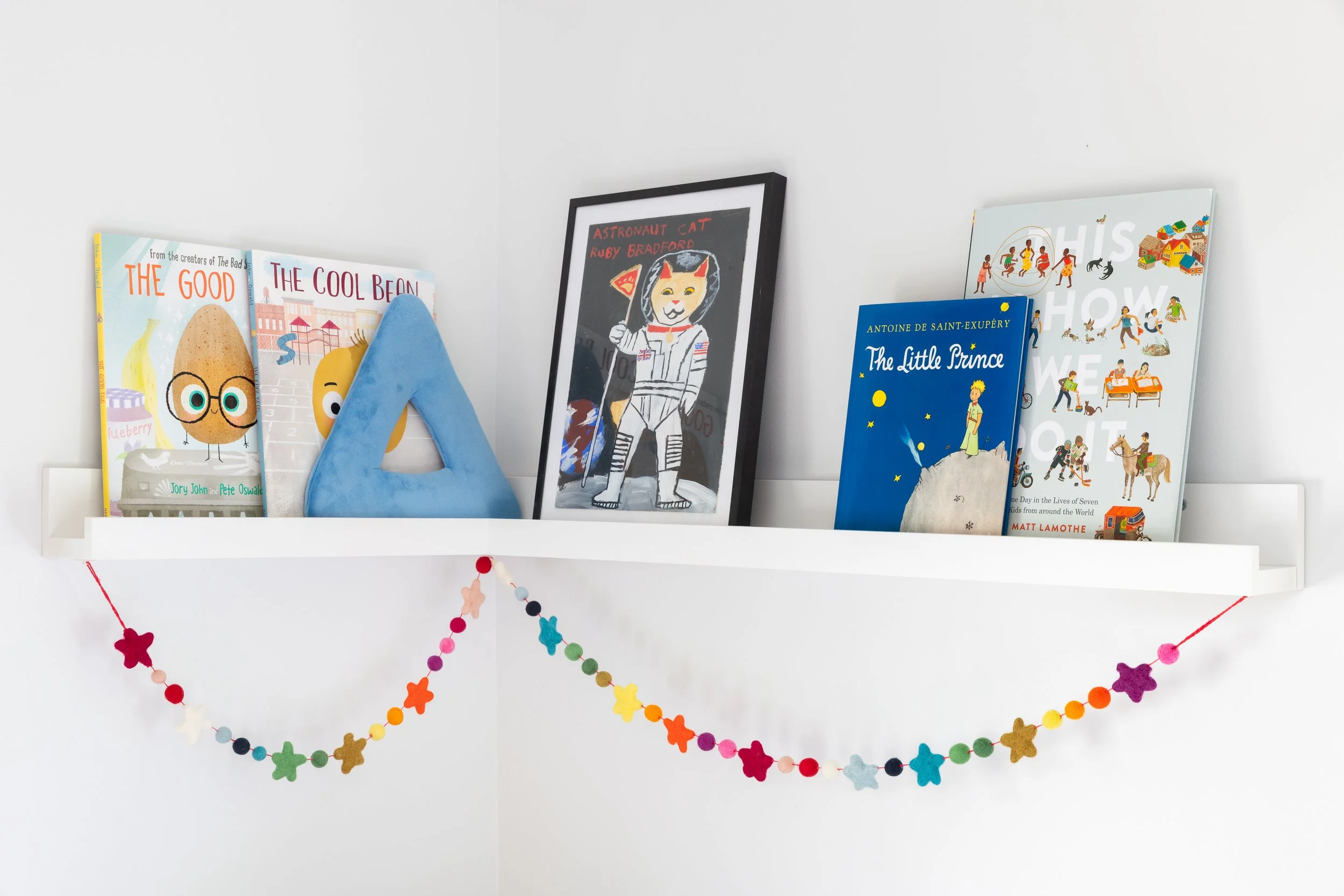 Children's room detail bookshelf art felt garland