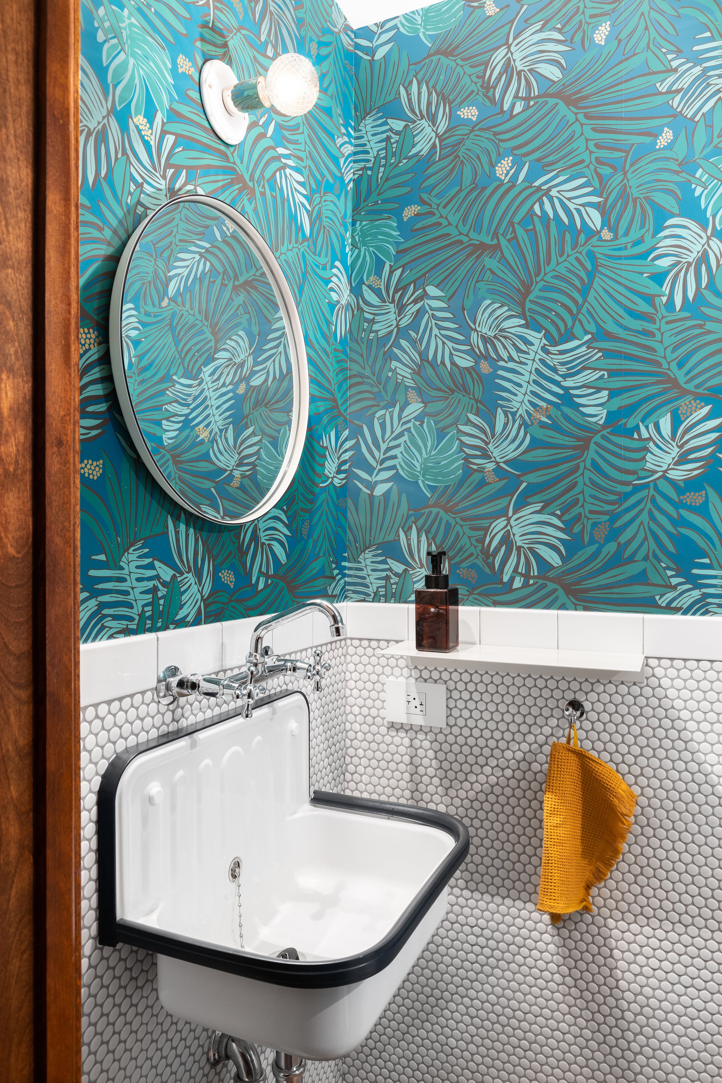 Powder room botanical wallpaper penny round tile wall mounted sink