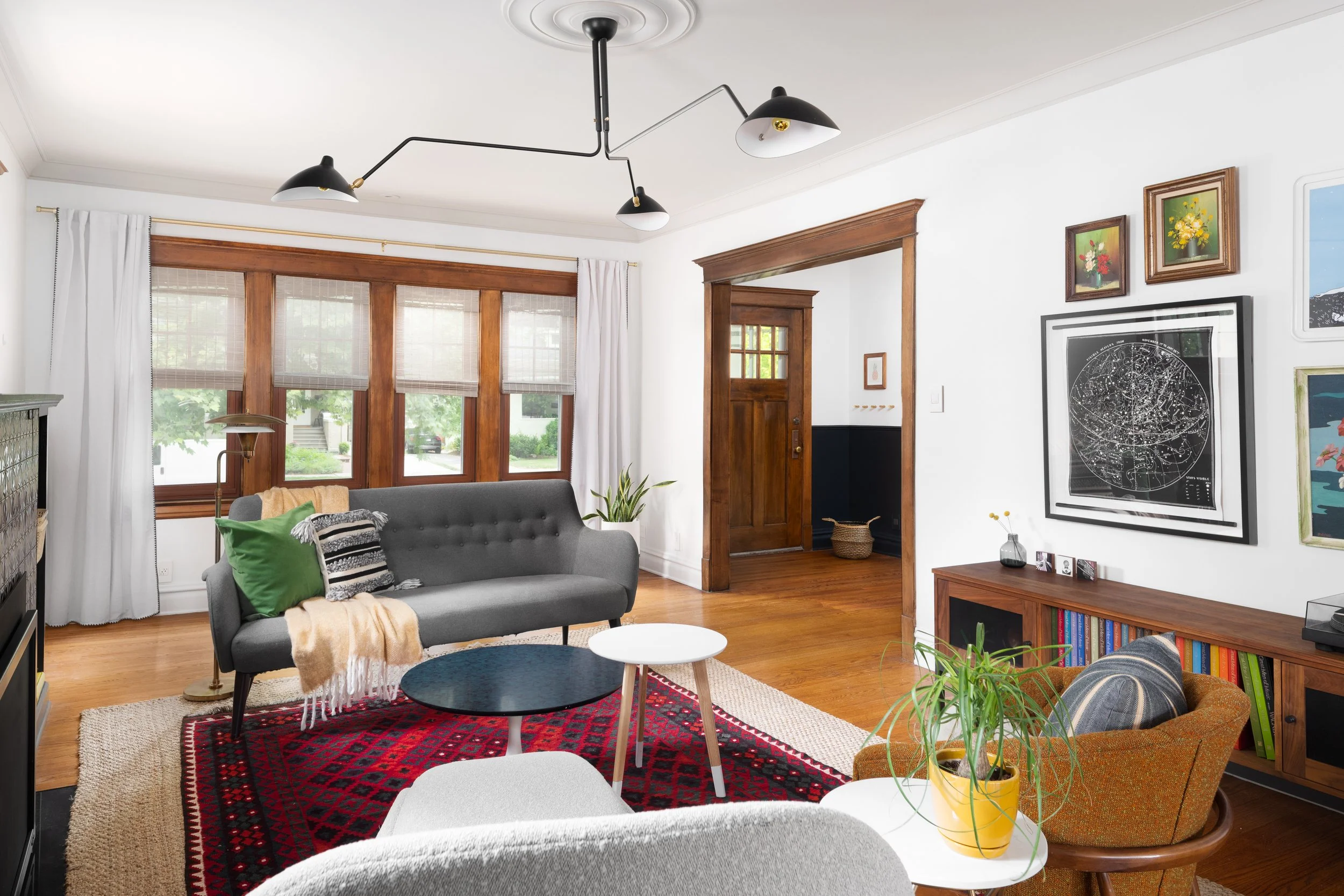 Overall living room with view into two-tone entry