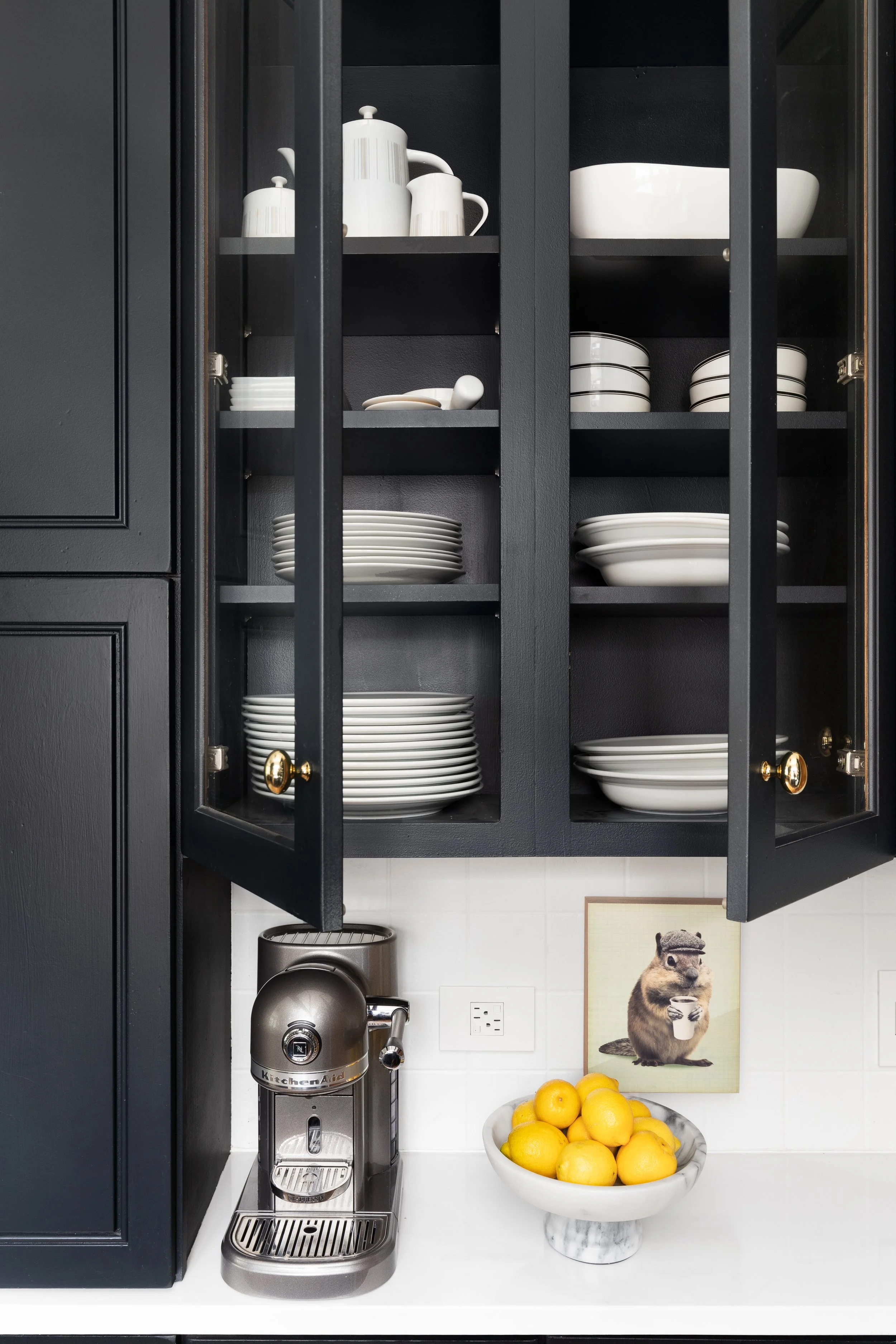 blue cabinets glass fronts white plates