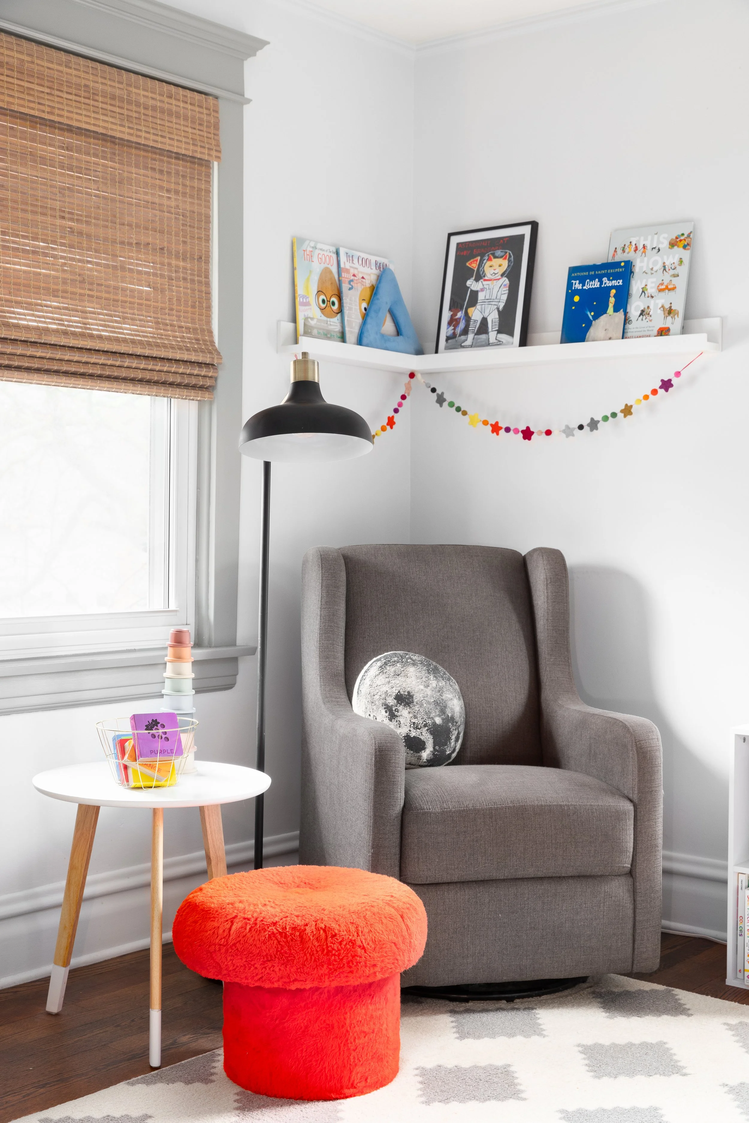Children's room rocking chair and bright red ottoman