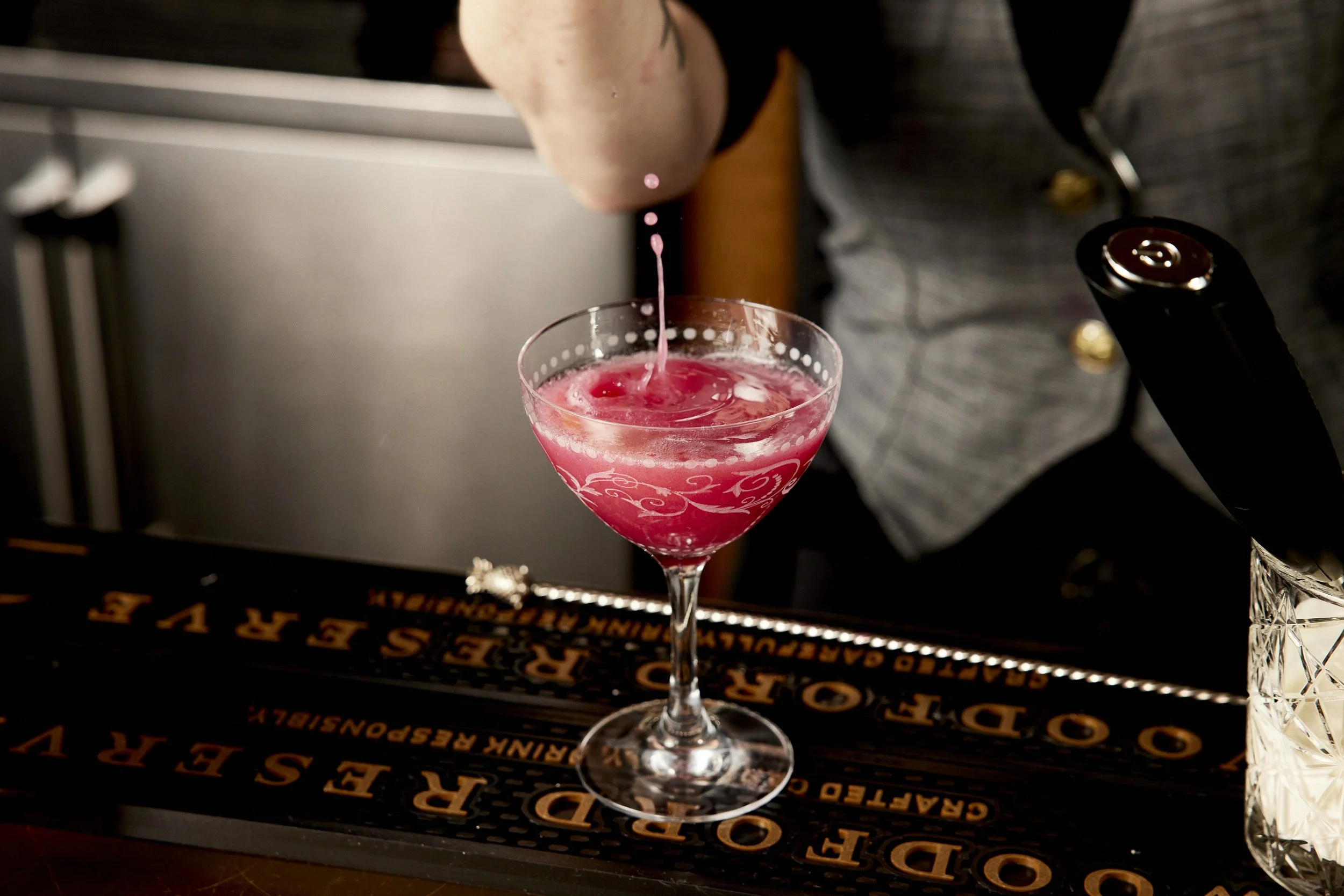 The base layer of this drink is a house made cranberry sauce, Cointreau and Absolut infused with cinnamon, orange peel and clove. 