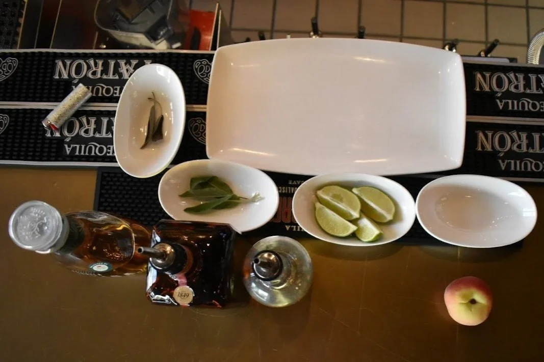 tequila, orange liqueur, sage simple syrup, lime, peach, sage smoke