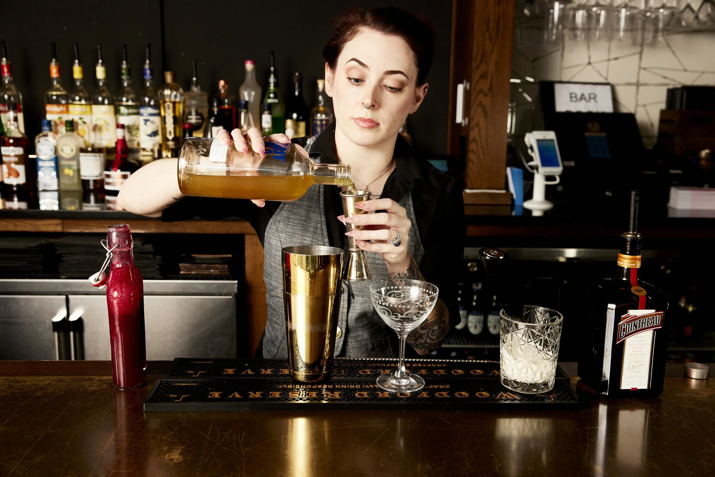 pouring the infused Absolut for my Cranbrosia cocktail